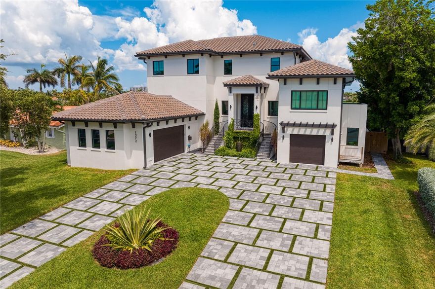 Accepting BACKUP OFFERS 

Situated on a cul de sac in the highly desirable Yacht Club Estates this is a NEWER construction DREAM!! Built in 2021 this ALL block with reinforced concrete pilings waterfront home will take your breath away. This stunning home boasts 5 bedrooms, 4 bathrooms, 3 car garage, theater room, office, wine wall, bonus rooms, storage, multiple fireplaces, infinity pool with sunken fireplace, wet bar, coffee bar and an outdoor kitchen. This move in ready home is the epitome of the Florida Dream with water views from every bedroom. Just minutes to the beaches and within 35 minutes to Tampa International Airport.
 So many exquisite details to uncover you must come look for yourself! Dock plans are ready and in the process of being built.