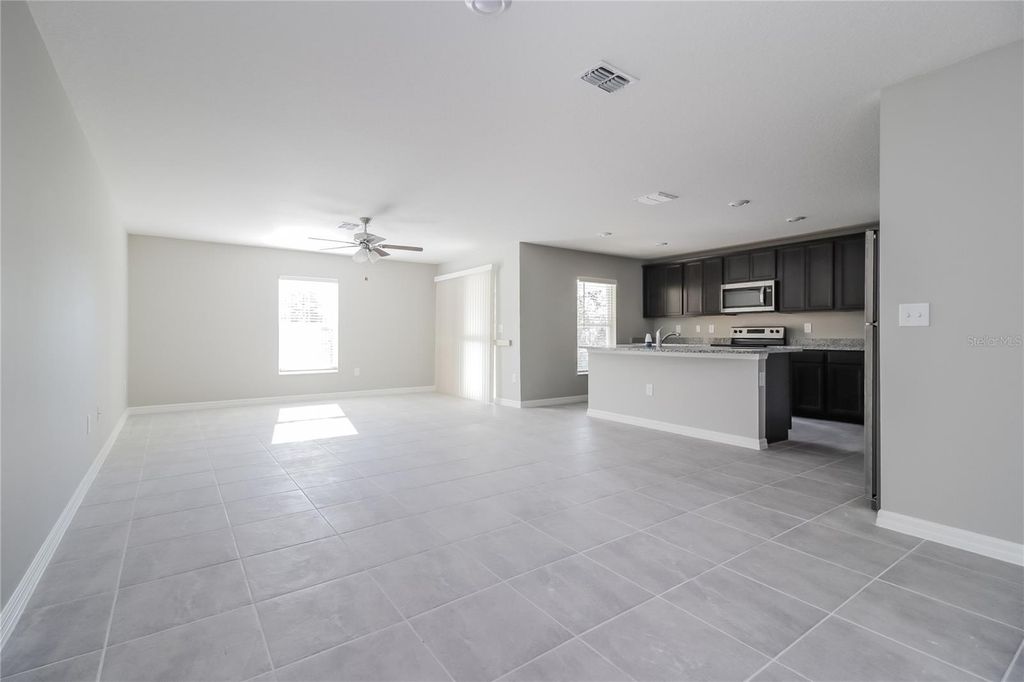 Photo of 127 Tulip Lane, Kissimmee, FL 34759 (MLS # O6402921)