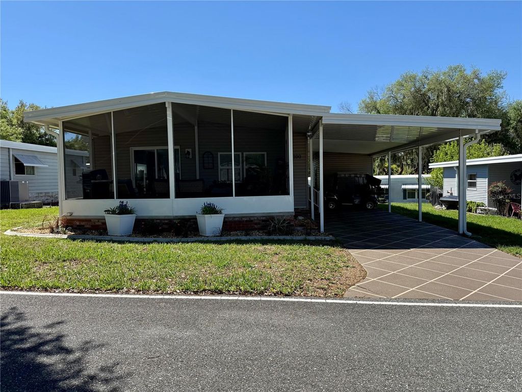 Photo of 100 Papaya Cove, Leesburg, FL 34748 (MLS # G5109931)