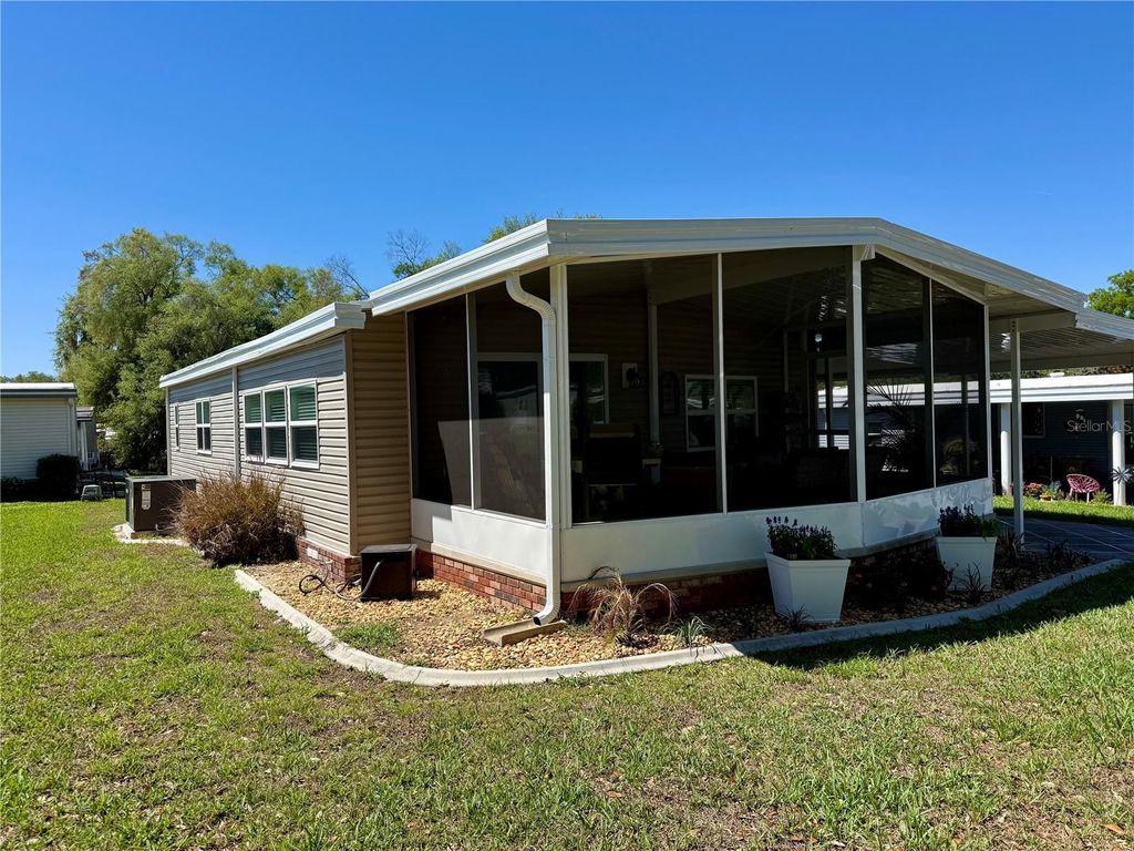 Photo of 100 Papaya Cove, Leesburg, FL 34748 (MLS # G5109931)