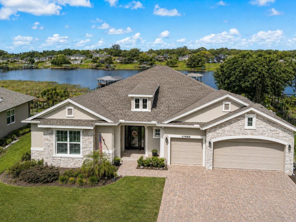 Photo of 17088 Secret Hollow Loop, Clermont, FL 34711 (MLS # O6405582)
