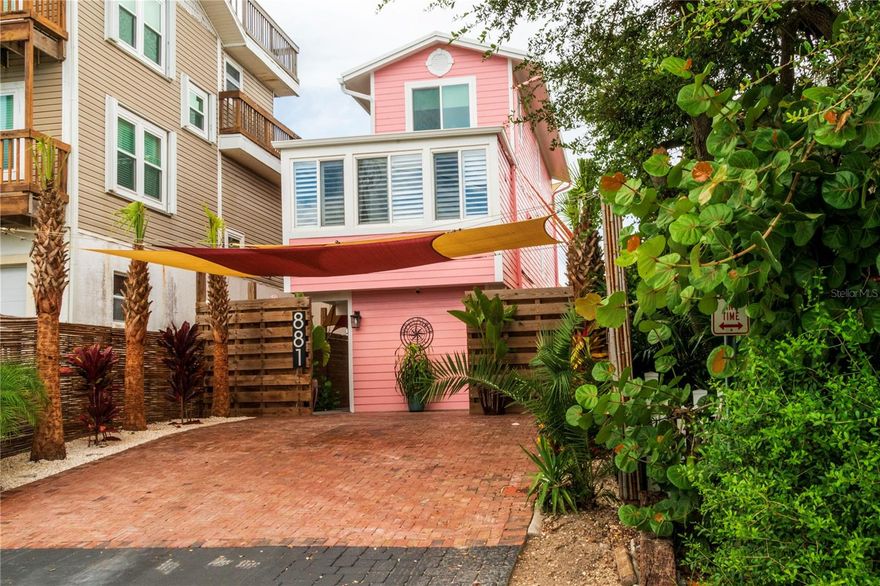 Incredible Beachside Investment Opportunity! Nestled on a quiet dead-end street in the coveted Bethune Beach community, this stunning three-story single-family home at 881 Catfish Ave offers breathtaking lagoon views from nearly every room — plus a fully separate and private guest residence with its own entrance, perfect for generating rental income (30-day minimum), long-term stays, or hosting family with complete privacy. The main living area features a beautifully updated kitchen, an open-concept layout, and balconies on both upper levels facing the tranquil lagoon. Upstairs, you'll find a spacious master suite and guest bedroom, both with water views. Recent upgrades include new impact-resistant windows for added safety and efficiency. Step outside to your private backyard retreat with a fenced yard, built-in BBQ grill, and your very own outdoor sauna — ideal for entertaining or relaxing after a beach day. With no public beach parking nearby, this location is exceptionally peaceful yet just 3 miles from lively downtown New Smyrna Beach with shops, restaurants, and more. Whether you're seeking a personal coastal getaway or a high-performing Airbnb/VRBO property, this home offers unbeatable value and lifestyle in one of Florida’s most desirable beachside communities.