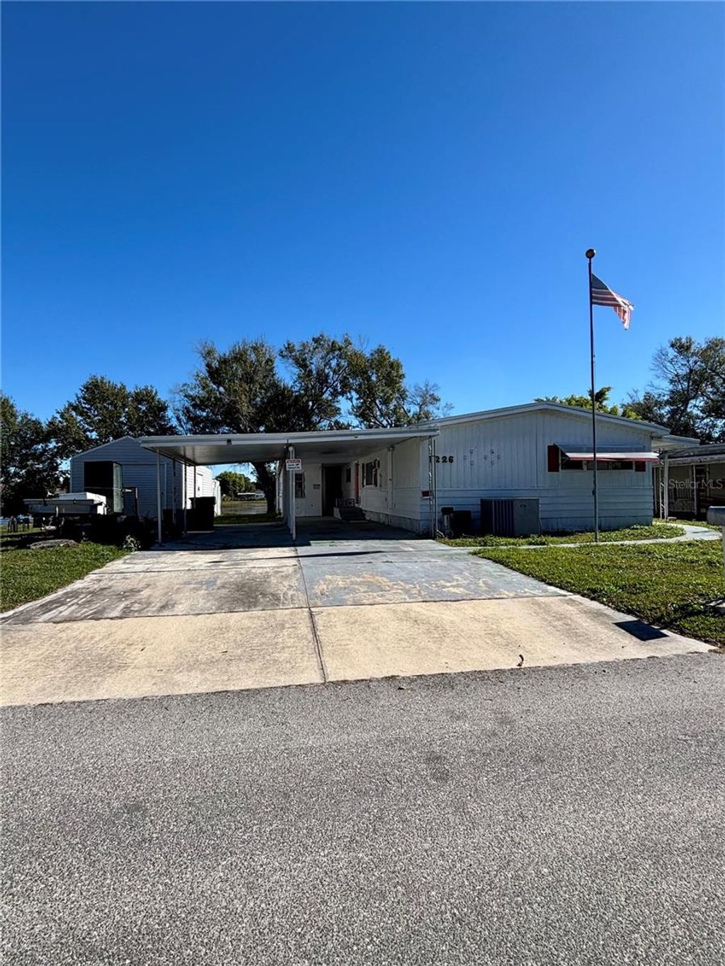 Photo of 1226 Country Club Lane, Lakeland, FL 33801 (MLS # L4958437)