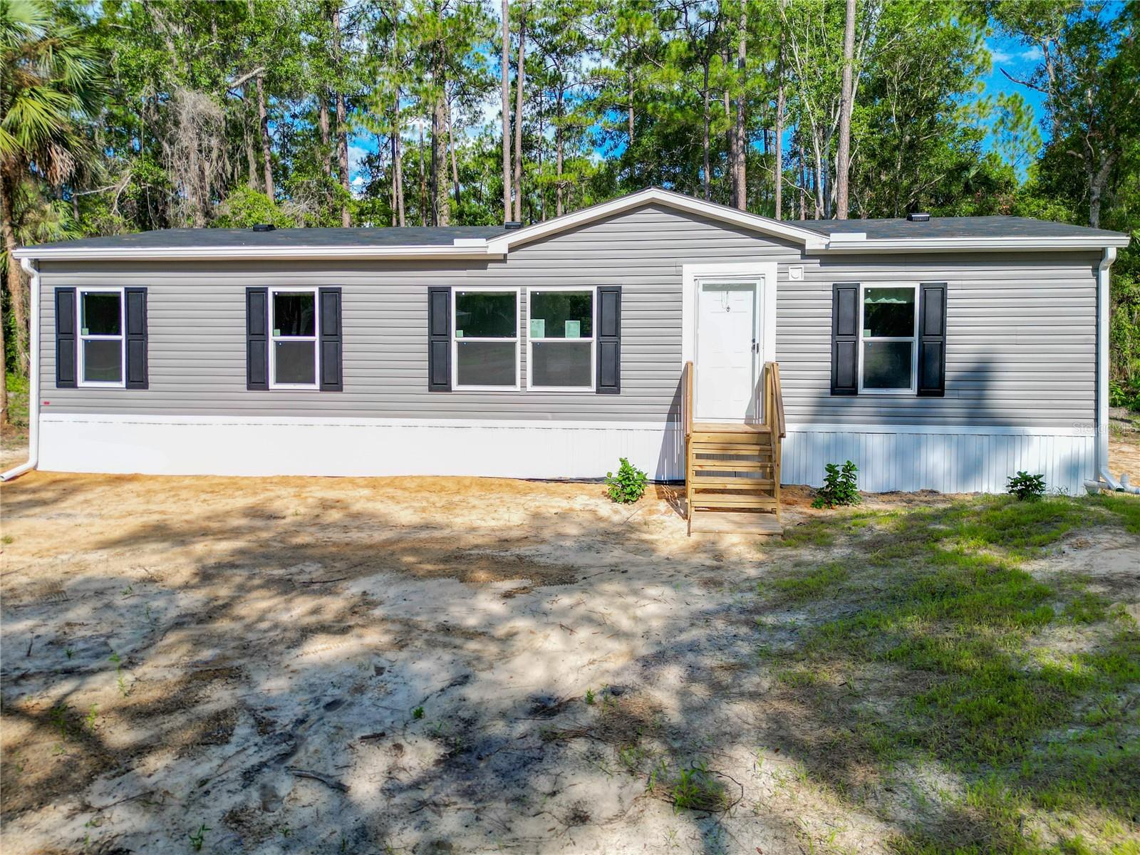 One or more photo(s) has been virtually staged. Your new home awaits you! This charming 3-bedroom, 2-bathroom home sits on a full acre in Inglis, offering the perfect blend of peaceful living and easy access to outdoor adventure. With close to 1,400 square feet of living space, this home provides a comfortable layout ideal for both retirees or raising your family. Master bedroom offers plenty of space for a king-sized bedroom suite and has a large walk-in closet. Both extra rooms are perfectly fitting for your children, guests, or even office space. Located just a short drive from Crystal River, you'll be minutes from world-class water activities like scalloping, boating, kayaking, and manatee encounters. Prefer freshwater fun? The Rainbow River is also nearby, offering crystal-clear spring waters perfect for tubing, swimming, and paddle-boarding. Call today for a showing !