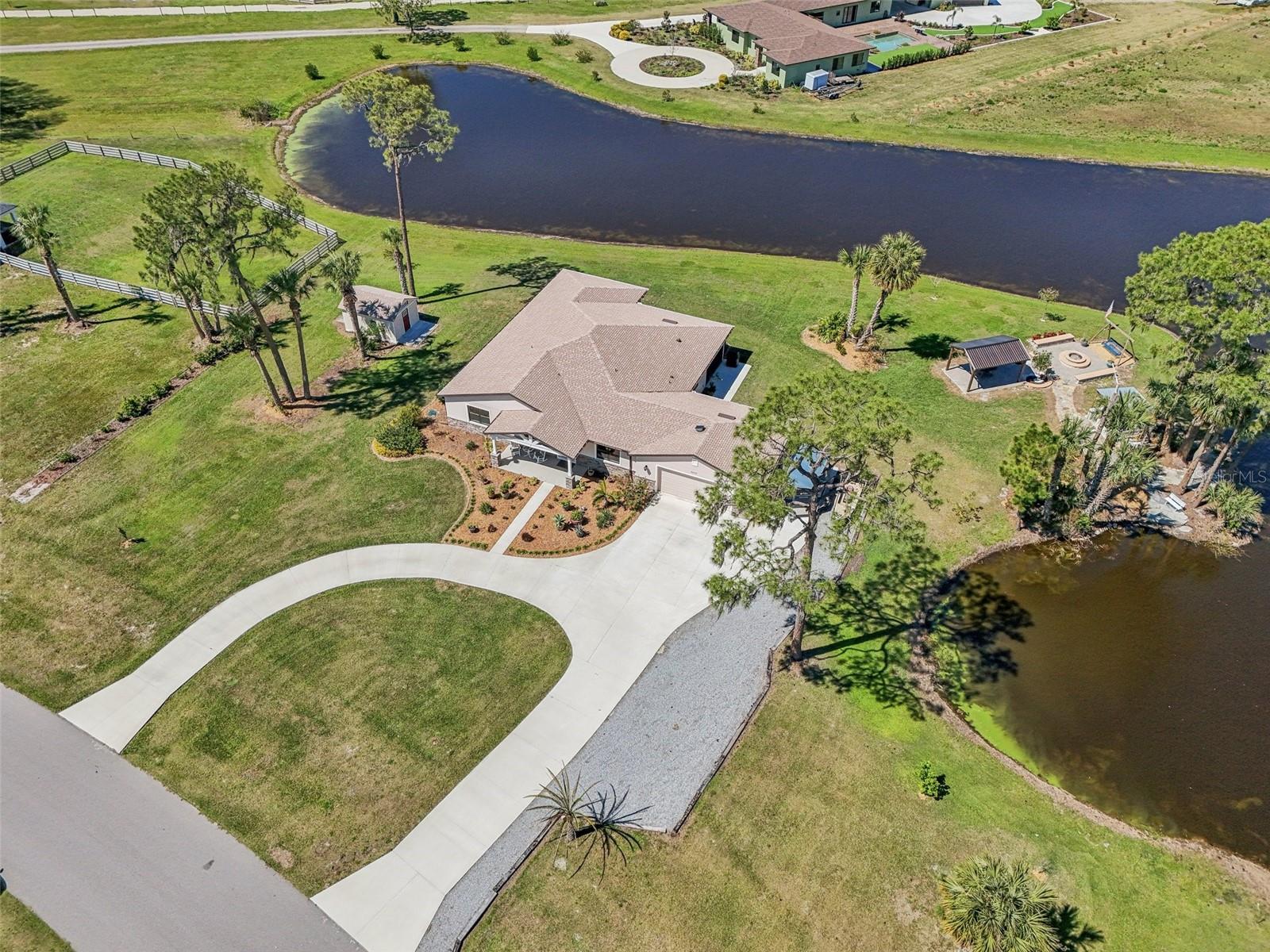 One or more photo(s) has been virtually staged. FULL CHAIN OF LAKES ACCESS / 2022 CUSTOM HOME FOR THE BEST PRICE IN THE AREA. *** There are not many places where you can buy acreage homesite; with full lake access and still access all Central Florida provides.*** Beautifully crafted 2022 Custom Home. This home provides a transitional style that will showcase your modern or traditional style! Room for a pool! Hidden River Lakes community of Tavares, nestled just minutes from the charming downtown of Tavares and the historic allure of Mount Dora, this custom-built 2022, 3-bedroom, 3-bathroom home boasts 2,802 square feet of thoughtfully designed living space. The office has a closet and could be a 4th bedroom. Situated on a sprawling 1.6 acreage homesite, this property offers unmatched privacy and room to breathe, surrounded by the natural beauty of Central Florida’s lake country. OWNERS ARE MOTIVATED. SCHEDULE YOUR VIEWING TODAY.
Beautiful location, with mature landscaping and pond views with stunning architectural details throughout. Sweeping chef kitchen, stainless steel appliances including double convection oven, induction cooktop, self-trim farmhouse sink, large island plus expansive breakfast bar and extensive storage options. Quartz countertops throughout and marble tile features. Hard wood floors and porcelain tile, high ceilings; 8ft doors and crown moulding. Oversize 710sqft garage (25x26). Additional 12x16 shed.
Stunning outdoor features that include custom made seating and wood burning fire-pit / gazebo and tailored BBQ / Smoker area to fully immerse yourselves in the tranquil setting that wraps around the home. Garden is laid to lawn and leaves ample room to add a pool if desired.
A standout feature of this home is its prime location within Hidden River Lakes, a gated community celebrated for its direct access to the Harris Chain of Lakes via a private community boat ramp. Launch your boat and explore over 75,000 acres of pristine waterways, including Lake Harris, Lake Eustis, and Lake Dora, perfect for fishing, boating, or simply soaking in the stunning sunsets. The community’s proximity to Tavares—less than an hour from Orlando’s world-class attractions and international airport—blends rural tranquility with urban convenience. Golf enthusiasts will appreciate being just a short drive from Deer Island Club, while nature lovers can enjoy nearby trails and preserves.
This custom home is a rare gem in a neighborhood of expansive lots and low HOA fees, offering the freedom to bring your vision to life. Whether you’re seeking a peaceful retreat or an active lakeside lifestyle, this Hidden River Lakes treasure at 32778 delivers the best of Florida living. Schedule your private tour today and experience the magic of this waterfront community!