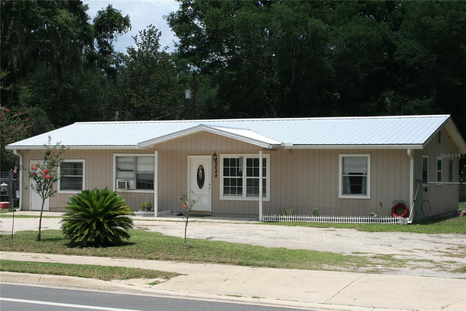 Nice large home with a possible in-law area, Has a 1/2 bath and separate entry. Formerly a converted garage. Split bedroom plan. Well maintained. Large, fenced back yard perfect for the pets and or the kids. Concrete patio off the back. Very close to all of the shops & schools.
Just east of Gainesville. A short drive in on St road 20, The undeveloped property to the east is owned by the City. Possibly a future city park