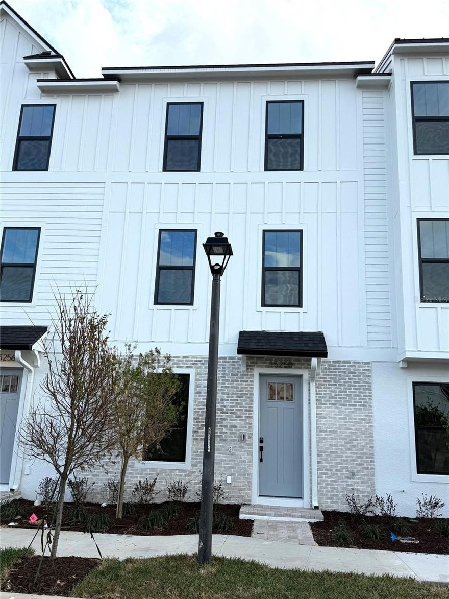 Ready Now! This new construction, three-story townhome (The Lantana) is a showstopper with its popular farmhouse exterior. This townhome features 3 bedrooms, 2 full bathrooms, a powder room, spanning 1,846 sq. ft. As you enter this home through the 8' entry-door, you are welcomed with an open spacious foyer with immediate access to your study and storage area. As you continue up, you will find luxury vinyl plank flooring that that leads you to the open concept living room, dining room, and stunning kitchen. Your inner gourmet will be delighted by the large eat-in island, 42" cabinets with crown molding, quartz counters and soft-close drawers. Your eyes will be drawn to the bank of windows flooding your dining room and kitchen with light. Moving to the third level, you have quick access to the generously sized primary suite that accesses your ensuite bathroom with glass-enclosed shower, dual vanities, and the roomy, well-lit walk-in closet. Adjacent to the primary suite is your laundry room with adjacent, secondary bedrooms and guest bath.