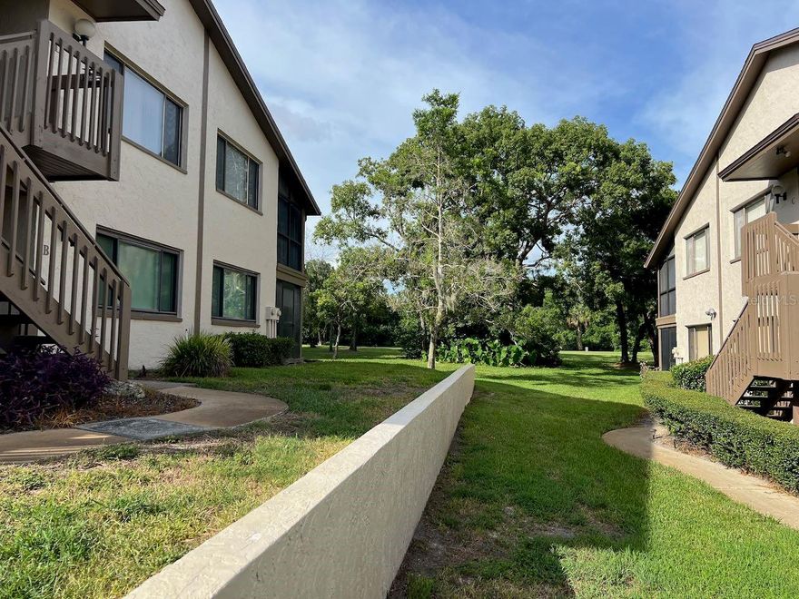 55+ second floor condo with excellent views of the serene and beautiful golf course. The open floor plan has an efficient kitchen, large enough for a small table. The is a open porch off the kitchen that is enjoyable for your morning coffee. The laundry facilities are in a closet in the kitchen so it is easy to prepare meals while doing a load of wash. This floor plan is open to the dining area and living room making it feel spacious. In addition, there is a cozy side room that was originally designed as the dining room. But most owners use this as extra space for crafts, reading or other activities. The bedrooms are split being in opposite ends of the unit so quiet and privacy are assured. The guest room has a full bath conveniently next to it.  The primary bedroom has an ensuite full bath. There are views of the golf course and trees- very peaceful. The living room has a screened porch that also overlooks the golf course. 

There is a dedicated carport to keep your car out of the sun and weather. The condo complex has its own pool, hot tub and shuffleboard as well as a community center. The condo complex is part of the much larger and desirable Beacon Woods. Beacon Woods is built around a picturesque golf course. The Beacon Woods community has winding roads and mature trees with many ADDITIONAL amenities such as: heated pool, lighted tennis and pickleball courts, basketball, play area, exercise room, bocce ball and more. The clubhouse has many activities including but not limited to: dances, cards, yoga, and seasonal gatherings. The monthly fee for this condo is only $410 per month that covers all this: exterior maintenance, garbage, water, sewer, cable tv with Internet, pool, shuffleboard and dues for the larger Beacon Woods community. Your only utility bill will be the electric you use. Sweet! There are maintenance personnel on grounds everyday in case the exterior of the condo complex needs attention. This condo has one of the best run Boards. Major upgrades have been made to the complex and the condo budget has sufficient reserves for future maintenance. There are no major improvements needed, keeping your monthly costs low with NO future surprises. All dimensions are approximate and buyer is urged to confirm items of significance to them. The furniture and ALL APPLIANCES ARE NOT included in the price. It is a joy to live here. This is one of the best values in this community.  Buyers are urged to verify all information deemed important to them and to review association documents. All dimensions are approximate. The unit can be rented after 2 years of ownership.