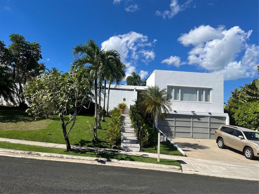 This Garden Hills South has the layout to become the luxurious gem of the community. It is within the second guard access and in a very low traffic street.  The home has three en suite bedrooms plus a downstairs in law suite or apartment that can easily be transformed into separate man cave, office and wine cellars.  A large kitchen flooded with natural light and a movie theater/flex room ready to become the great room.  The generator can power the entire home and the two car garage has plenty of storage space.