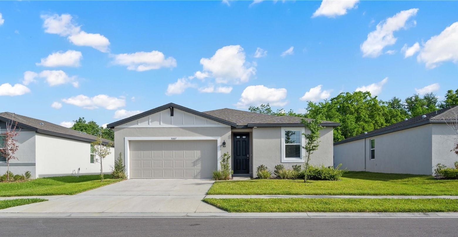 Welcome to this brand-new, energy-efficient home in Zephyrhills, Florida, built in 2023 by Meritage Homes. Situated in the desirable Bristol Meadows community, this 3-bedroom, 2-bathroom home offers 1,491 square feet of modern living space, complete with a 2-car garage. Located in a peaceful cul-de-sac, you'll enjoy both privacy and tranquility in your fully fenced backyard—perfect for outdoor relaxation and enjoyment. Step inside to find a thoughtfully designed interior with tile floors throughout the main living areas for easy maintenance. Both guest bedrooms offer cozy carpeting and built-in cabinets, providing extra storage space for your convenience. The open-concept kitchen is a true highlight, featuring stunning granite countertops, a breakfast bar/island, stainless steel appliances, solid wood cabinetry, and a spacious pantry—ideal for meal prep and entertaining. The laundry room is conveniently located within the home, making chores a breeze. Retreat to the generous master bedroom, where plush carpeting and a walk-in closet await. The master bathroom offers a luxurious dual-sink vanity with granite counters, a step-in shower, and modern finishes. The guest bathroom includes a tub/shower combo for added flexibility. This home is designed with both style and function in mind, offering the perfect blend of modern comforts and practicality. Located with easy access to the interstate, you'll be just minutes away from all that the Tampa Bay area has to offer. With NO CDD fees and a LOW HOA, this is a fantastic opportunity to own a move-in-ready home in a prime location. Call today to schedule your viewing and see why this home is the perfect choice for you!