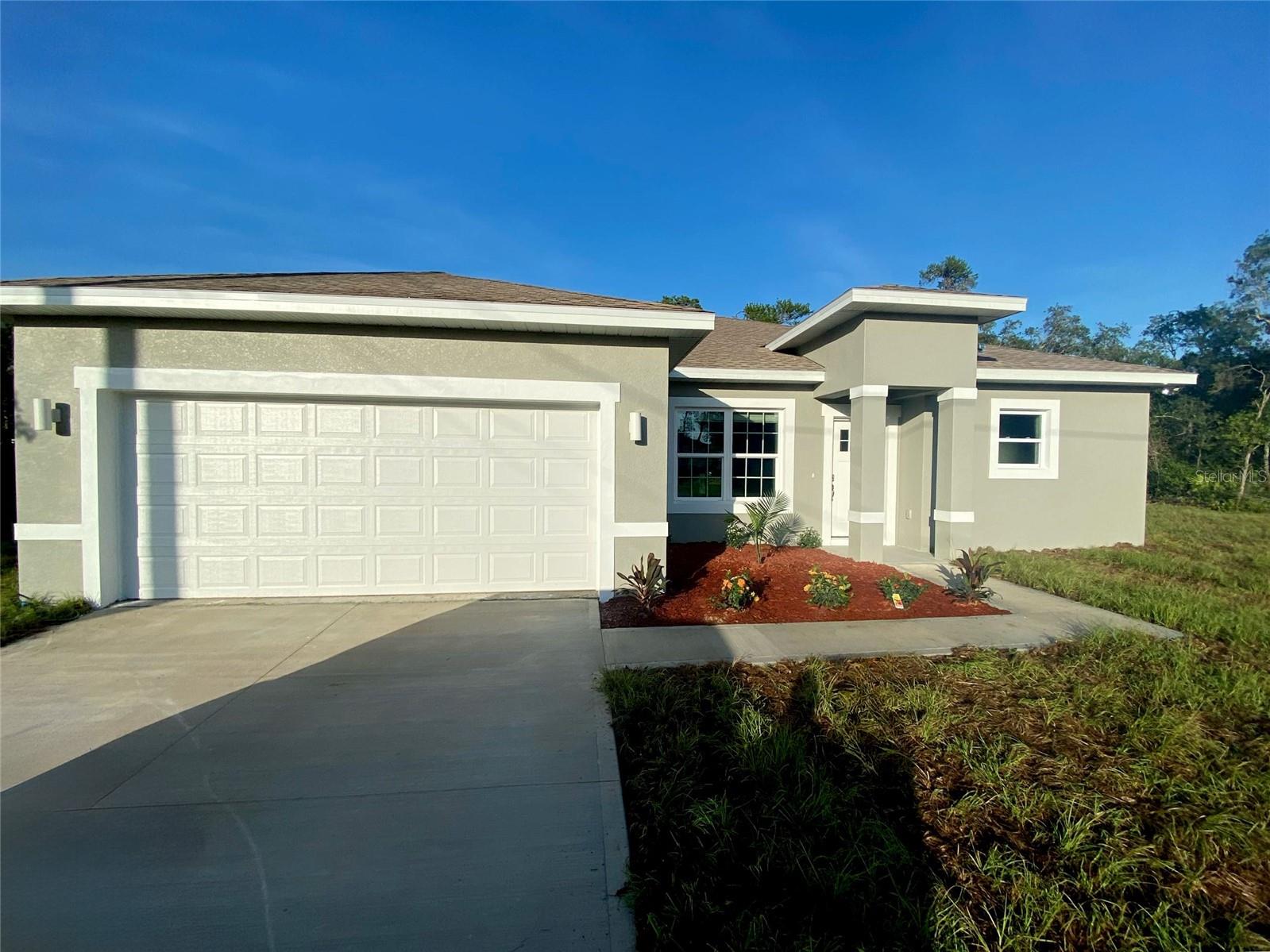 Under Construction. Beautiful new home in Citrus Springs featuring 4 bedrooms, 2 and A HALF bathrooms, a spacious 1,679 sq ft heated area, and a 2,224 sq ft total plan. The kitchen showcases a modern WATERFALL QUARTZ island and comes fully equipped with stainless steel appliances—refrigerator, range, microwave, dishwasher, and disposal. The master suite is a true retreat, featuring a STANDALONE TUB, a glass-enclosed SHOWER DOOR, and dual vanities. Additional features include a SMART KEY entry system and a 2-10 HOME WARRANTY. Buyers can receive up to $1,000 in additional lender credits toward appraisal and credit report when financing through On Target Mortgage, the preferred lender. Don't miss this opportunity—schedule your showing today!