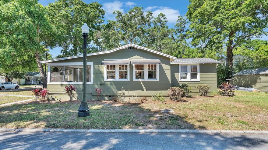 Enchanting 1920s Bungalow in exclusive central Lakeland Lake Hollingsworth Neighborhood!

Discover the perfect blend of timeless elegance and modern luxury in this stunningly remodeled 1920s bungalow, nestled in the highly desirable and super-safe Lake Hollingsworth neighborhood. This peaceful, tree-lined community offers an idyllic setting with a pleasant 4-minute walk to the renowned Lake Hollingsworth Trail. The town of Lakeland is a perfect spot in central Florida located halfway between Orlando and it's theme parks and Tampa and the Gulf Coast Beaches.

Boasting 2 bedrooms and 2 bathrooms, this home has been meticulously updated while lovingly preserving its authentic 1920s character. Warm original hardwood floors flow throughout the home, beautifully complemented by natural bamboo blinds and soothing ceiling fans in every room.

The heart of the home is the bright, brand-new gourmet kitchen, featuring a chef’s dream gas range, a large original ceramic farmhouse sink, elegant quartz countertops, rich solid wood cabinets with soft-close drawers, charming accent shelving, abundant task lighting, and a spacious added pantry cabinet, making meal preparation a true delight.

The spacious primary bedroom offers a generous walk-in closet and plenty of room for a king-size bed and furniture, while offering a luxurious en-suite bathroom.  The second bedroom provides wonderful flexibility for guests, or a home office, and the second bathroom retains its charming vintage appeal showcasing a beautifully refinished original clawfoot tub.

A large, inviting dining room creates the ideal space for entertaining family and friends, and a convenient inside laundry room adds effortless everyday living.

Step outside to enjoy the expansive new back deck, perfect for morning coffee, sunset dinners, or lively weekend gatherings. The classic screened front porch invites you to relax and soak in the peaceful neighborhood views.

Additional highlights include the original carriage house complete with an attached bike barn, offering rare historic charm and excellent storage for bicycles, tools, and outdoor equipment.

This beautifully maintained home has been a highly successful and profitable Airbnb, consistently attracting strong bookings thanks to its unbeatable location, historic allure, and thoughtful modern upgrades.

If you’re seeking a move-in-ready gem in one of Lakeland’s most sought-after neighborhoods or continuing it’s Airbnb legacy, this enchanting bungalow is a rare find. Schedule your private showing today and experience the irresistible charm of 1920s nostalgia seamlessly blended with contemporary comfort and just steps from the lake!

Newer Roof, Instant Hot Water Heater, 2025 A/C
