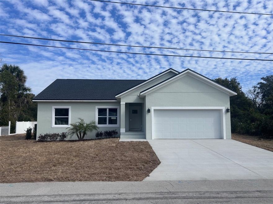 Fabulous New Construction home in New Smyrna Beach.  This 3/2 plus 2-Car garage offers spacious Kitchen with Quartz Counter, oversized inside laundry, ample size front and rear porch, and wall to wall tile.  In walking distance to Canal Street, Downtown, Marina and short bike to the beach.  Move in ready!! Must See!!