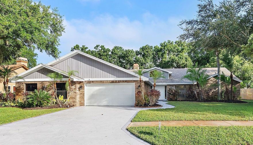 Tucked near the end of a quiet cul-de-sac, sitting on 1/3 acre, and overlooking the 16th fairway of Tarpon Woods Golf Course, this spacious 4-bedroom, 4-bath home offers over 4,800 sqft of comfortable single-level living with a new roof (2022) and fresh interior and exterior paint. The layout includes a large formal living room with a striking fieldstone fireplace, skylights, and a built-in wet bar, perfect for entertaining. A bright sunroom and family room open to tranquil views of nature, where residents often enjoy watching deer and wild turkeys roaming the fairways. The kitchen features cherry cabinetry, granite countertops, and a generous breakfast area, while one section of the home is ideally positioned to be converted into an in-law suite with minimal effort—offering exceptional flexibility for multigenerational living or guest accommodations. Generously sized bedrooms, four full baths, and a two-car garage complete this well-maintained residence, all within minutes of Lake Tarpon, John Chestnut Park, Gulf beaches, shopping, and top-rated schools.