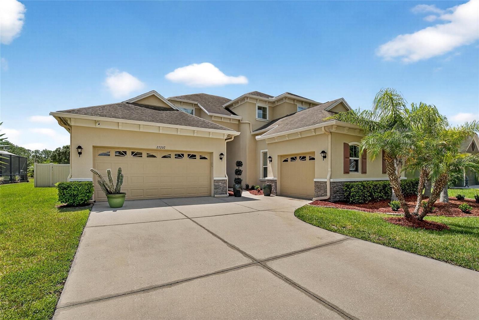 Stunning 4 bed, 3 full bath + 2 half-bath home in the gated neighborhood of Quail Woods! This 3,227 heated sq ft Southern Crafted “Strathmore II” model sits on a premium conservation lot with no rear neighbors and a fully fenced backyard. Property is high and dry and has never flooded. Inside, enjoy soaring 10-ft ceilings, crown molding, and an open floor plan perfect for entertaining. The gourmet kitchen boasts granite counters, custom cabinetry, a center island, stainless steel appliances, and a walk-in pantry. The spacious first-floor primary suite offers a sitting area, dual walk-in closets, and a spa-like bath. Upstairs features 3 bedrooms, 2 full baths (including a Jack & Jill), and a large loft with access to a usable balcony. Home features upgraded wood-looking tile throughout (2024), double pane windows, new water heater (2025), new upstairs A/C (2024). Outdoor living shines with a covered patio and expansive backyard. The split 3-car garage includes a 2-car bay and a separate single-car bay with private access to an office/flex room—ideal for a multigenerational living setup, home business, or hobby space. The Quail Woods neighborhood offers a Frontier cable and internet, a playground, a shaded picnic area, nature trails, and open green space perfect for sports and recreation. No CDD, which means lower real estate taxes, and just minutes from top-rated schools, shops, dining, and I-75. A rare find—luxury, location, and lifestyle all in one! Approximately 30 minute commute to Tampa, 60 minutes to Clearwater & St Petersburg, and 90 minutes to Orlando. A rare find—luxury, location, and lifestyle all in one!