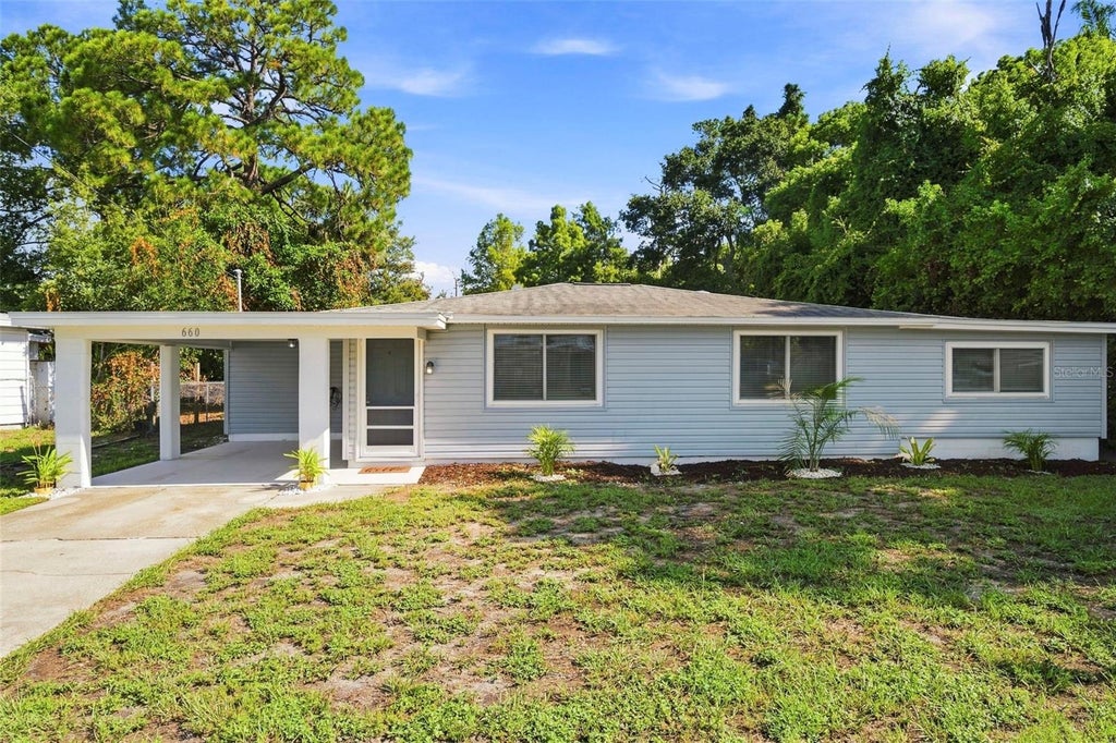 Photo of 660 Dexter Drive, Dunedin, FL 34698 (MLS # TB8542827)