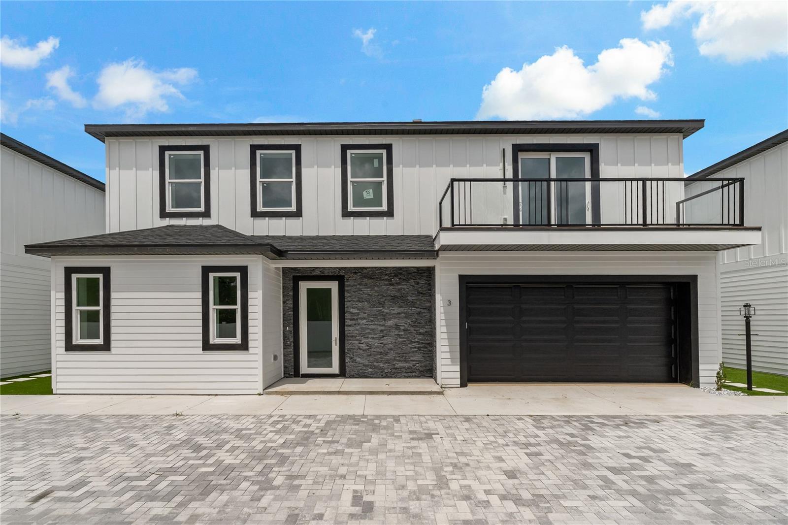 Live just one mile from vibrant Downtown Dunedin—an easy stroll or golf cart ride to shops, restaurants, breweries, and the waterfront! Built in 2024 with ICF insulated concrete forms, this two-story luxury home offers modern design, energy efficiency, and premium finishes throughout.
Inside, 10-foot ceilings, 8-foot doors, and Italian porcelain tile set an elegant tone. The gourmet kitchen features Calacatta quartz countertops, custom plywood cabinetry to the ceiling, and high-end stainless steel appliances. The open floor plan flows seamlessly into the living and dining areas, filled with natural light.
The primary suite offers a walk-in closet, double vanity, and stylish shower. Two additional bedrooms each have their own bathrooms, plus there’s a convenient half bath on the first floor.
Enjoy a private backyard with low-maintenance artificial turf, a two-car garage, guest parking, and a whole-home dehumidifier and air purifier for year-round comfort.
Perfectly located near the Pinellas Trail, marinas, and stunning Gulf beaches, this home combines modern luxury with the best of Dunedin’s coastal charm.