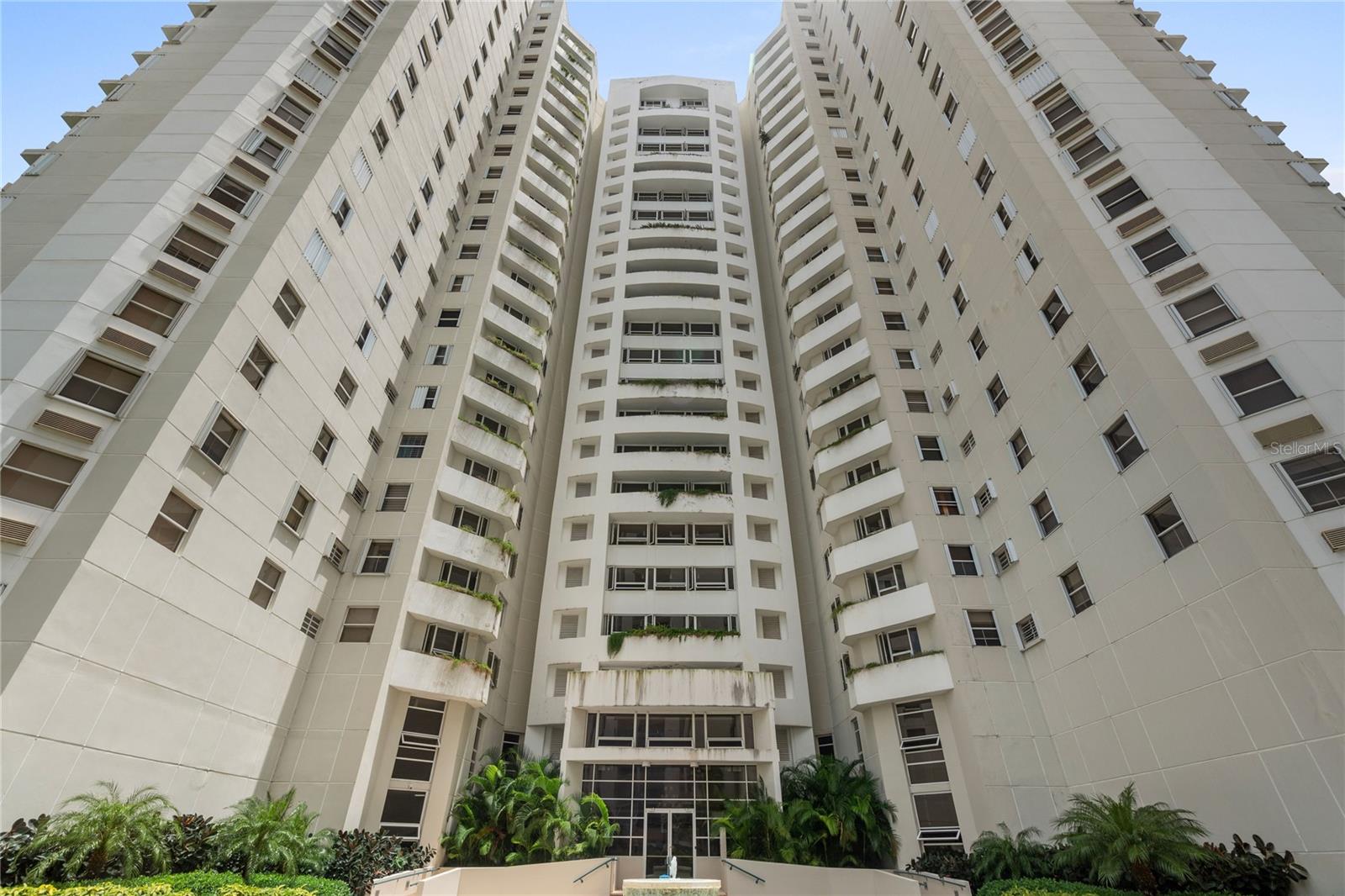Discover urban living at its finest in this spacious 3-bedroom, 2-bathroom Parque de Loyola condominium located right in the heart of San Juan's vibrant downtown. This one-story condo offers convenience and comfort with 2 back-to-back parking spaces, four air conditioning units, and essential kitchen and laundry appliances, including a refrigerator, stove, oven, washer, and dryer. Perfectly situated with views of lush greenery, this partially furnished unit is designed for easy living. The condominium boasts a range of amenities, including a pool with a deck, a gazebo, a playground, tennis courts with pickleball option, a gym, a library, and an activity room. For added peace of mind, the building offers 24-hour security and access control, as well as a generator for common areas, providing up to 20 amps to each residence, ensuring that essential appliances remain powered during outages. Ideal for families and professionals alike, this condo offers a blend of city vibes with the tranquility of nature, all while providing quick access to the expressway for easy commuting. This property is perfect for those looking to enjoy the best of San Juan's central, business-oriented lifestyle.