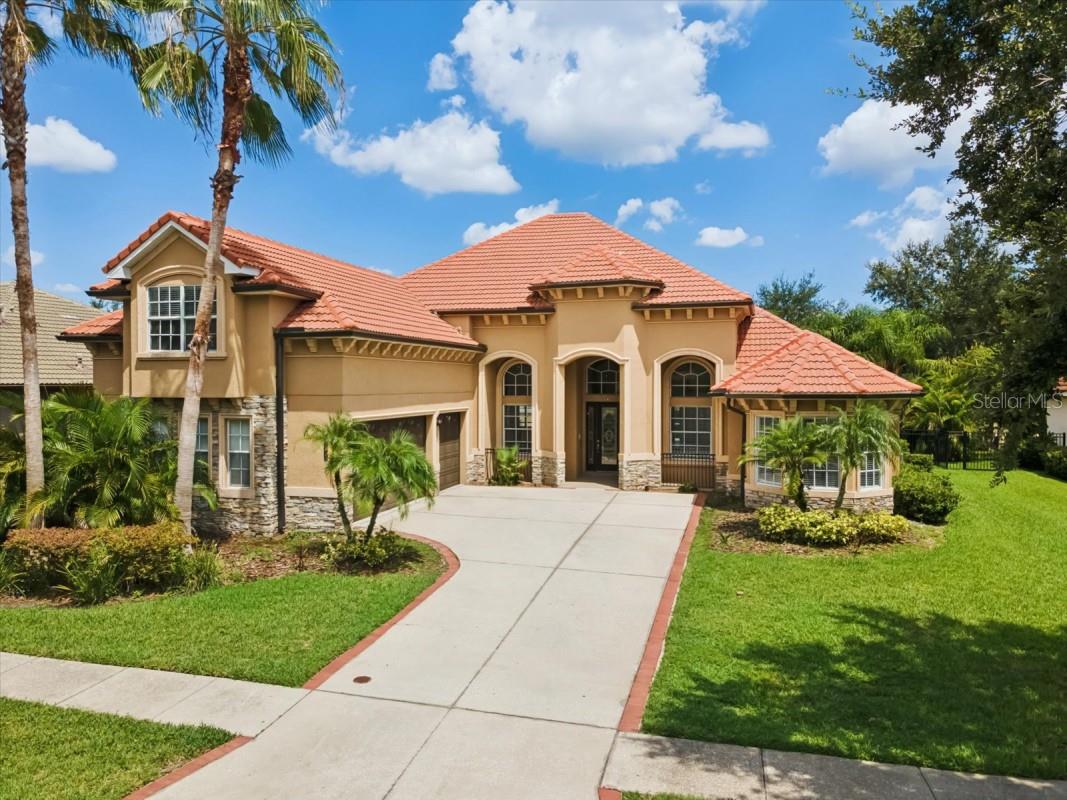 Discover the perfect balance of style and comfort in this spacious residence, located in the exclusive guard-gated community of Grand Hampton. Set on a private conservation lot with no rear neighbors.
From the moment you enter, the two-story foyer with soaring ceilings sets the tone for the home’s bright and open design. Tile flooring flows throughout the main level, where you’ll find a private office, a formal dining room, and expansive living spaces filled with natural light.
At the center of the home is the renovated chef’s kitchen, featuring shaker cabinetry, marble countertops, subway tile backsplash, and stainless-steel appliances. Overlooking the family room and casual dining area, this space was made for entertaining and everyday living.
Step outside through French doors to the screened lanai, where you’ll enjoy a sparkling heated pool, spa, and serene conservation views.
Upstairs, the owner’s suite offers a private retreat with room to unwind, while additional bedrooms provide flexibility for family, guests, or multi-generational living.
Grand Hampton residents enjoy resort-style amenities, including tennis courts, a fitness center, community pool, playgrounds, and scenic walking trails—all within a secure, master-planned neighborhood.
To add even more value, the seller is offering a rent-to-own option, giving you the ability to lock in this beautiful home today while retaining the flexibility to purchase when the timing and interest rates are right.