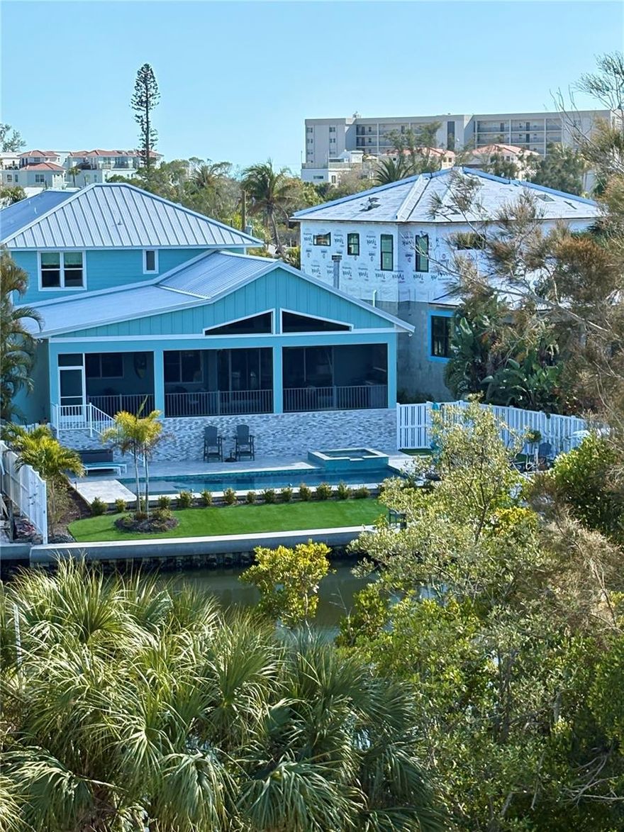 Waterfront Sanctuary on Palm Island - Outdoor Living Enthusiasts This is the One!
Your party is in the back with your own Very Private Backyard and Pool Area ready for family gatherings, sunset hot tubs, sunrise fishing, & poolside cocktails.

Newer construction meeting all hurricane standards and building codes. All living space is above base flood elevation. 

Welcome to an unparalleled blend of sophistication and coastal charm. Located on the exclusive Palm Island neighborhood of Siesta Key, this exquisite residence offers an extraordinary island lifestyle—perfectly positioned along the Grand Canal with close proximity to the pristine, sand Beach of Siesta Key and the vibrant energy of Siesta Village.
 
Spanning close to 3,500  square feet of meticulously designed living space, this newly built, custom home provides the ultimate in luxury and island living. The home includes 4 bedrooms, 4 full bathrooms, plus 2 additional half baths. Enjoy an additional, comfortable family room on the second floor. Every detail has been carefully curated to create a seamless balance of form and function. From the moment you enter, you'll be captivated by the open-concept layout, soaring ceilings, and walls of glass that flood the home with natural light, offering breathtaking panoramic views of the  Grand Canal, playful manatees, water birds, and lush tropical landscapes. The chef-inspired kitchen is a culinary dream, featuring top-of-the-line Thermador appliances, custom cabinetry, and an expansive, Quartzite island perfect for both cooking and entertaining. The spacious living and dining areas flow effortlessly into the outdoor oasis, where a resort-style pool, hot tub, gas fire pit and outdoor kitchen await. Whether you're hosting guests or simply enjoying a quiet evening, this home offers the ideal setting for any occasion. The first floor primary suite is a true retreat, with ship lap ceiling and accent wall and a spa-like bathroom that includes a walk-in shower and dual vanities. Each additional bedroom/en-suite has been designed with comfort and luxury in mind, providing private, serene spaces for family and/or guests. In addition to the gorgeous interior, the property offers 80 feet of water frontage and unrivaled outdoor amenities including a private dock with 10,000 lb. boat lift ideal for boating enthusiasts to access Sarasota Bay and beyond. 

Situated just moments from the world-famous Siesta Key Beach, Iconic Siesta Village, and the vibrant downtown Sarasota scene, 262 
Island Circle is the epitome of coastal, waterfront living. This is more than a home—it's an island lifestyle. This magnificent residence offers the perfect fusion of luxury, tranquility, and location. Discover your own slice of paradise on Siesta Key today. Call for a private showing.