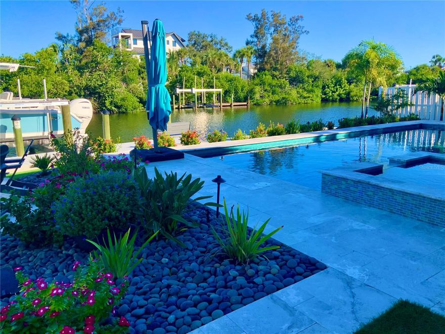 Waterfront Sanctuary on Palm Island 

Welcome to an unparalleled blend of sophistication and coastal charm. Nestled on the exclusive Palm Island neighborhood of Siesta Key, this exquisite residence offers an extraordinary island lifestyle—perfectly positioned along the Grand Canal with close proximity to the pristine, sand Beach of Siesta Key and the vibrant energy of Siesta Village.
 
Spanning close to 3,500  square feet of meticulously designed living space, this newly built, custom home provides the ultimate in luxury and island living. The home includes 4 bedrooms, 4 full bathrooms, plus 2 additional half baths. Enjoy an additional, comfortable family room on the second floor. Every detail has been carefully curated to create a seamless balance of form and function. From the moment you enter, you'll be captivated by the open-concept layout, soaring ceilings, and walls of glass that flood the home with natural light, offering breathtaking panoramic views of the  Grand Canal, playful manatees, water birds, and lush tropical landscapes. The chef-inspired kitchen is a culinary dream, featuring top-of-the-line Thermador appliances, custom cabinetry, and an expansive, Quartzite island perfect for both cooking and entertaining. The spacious living and dining areas flow effortlessly into the outdoor oasis, where a resort-style pool, hot tub, gas fire pit and outdoor kitchen await. Whether you're hosting guests or simply enjoying a quiet evening, this home offers the ideal setting for any occasion. The first floor primary suite is a true retreat, with ship lap ceiling and accent wall and a spa-like bathroom that includes a walk-in shower and dual vanities. Each additional bedroom/en-suite has been designed with comfort and luxury in mind, providing private, serene spaces for family and/or guests. In addition to the gorgeous interior, the property offers 80 feet of water frontage and unrivaled outdoor amenities including a private dock with 10,000 lb. boat lift ideal for boating enthusiasts to access Sarasota Bay and beyond. 

Situated just moments from the world-famous Siesta Key Beach, Iconic Siesta Village, and the vibrant downtown Sarasota scene, 262 
Island Circle is the epitome of coastal, waterfront living. This is more than a home—it's an island lifestyle. This magnificent residence offers the perfect fusion of luxury, tranquility, and location. Discover your own slice of paradise on Siesta Key today. Call for a private showing.