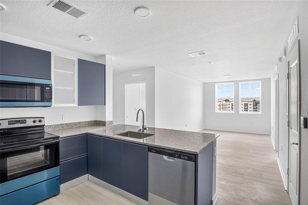 Photo of 5563 Millenia Park Blvd #517, Orlando, FL 32839 (MLS # O6445955)