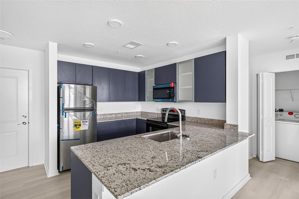 Photo of 5563 Millenia Park Blvd #517, Orlando, FL 32839 (MLS # O6445955)