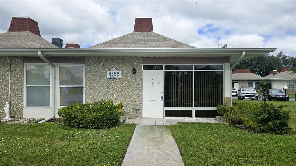 Photo of 4358 Tahitian Gardens Circle #H, Holiday, FL 34691 (MLS # TB8468101)