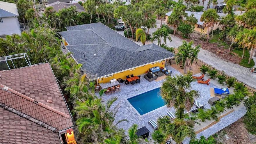 Less than .5-mile stroll to the warm sand and blue waters of Englewood Beach via your private entrance, this Manasota Key home provides the perfect backdrop for your escape to paradise. Let the healing smell of the salt air and the soothing sounds of the ocean lead you to your next home away from home. With all modern comforts in place all you have to do is relax on your staycation or extended rental. Tastefully updated with a 2 bedroom, 2 bath main house and private Casita featuring 1 bedroom and 1 bathroom. Beautifully furnished with a nautical theme. Everything you may need is provided, so pack lightly. Most of your time will be spent outdoors around the pool. Fire up the grill and lounge your day away. The pool is heated so enjoy year round. If you are creative in the culinary department, you are certain to appreciate the open kitchen concept. Modern appliances and the rarity of a gas range. Wi-Fi enabled with cable televisions in the living room and all bedrooms. After a hard day of play, a glass of Merlot on the screened lanai as the sun sets is the perfect ending. The illumination of the space creates a sense of enchantment as you are lulled by the crashing waves. With a private entrance, the Casita offers a bedroom, bathroom, television, small refrigerator and microwave; this provides well for guests. The home is located on a private lane with the Bay on one side and less than a half mile walk or bike ride to the pristine waters of Englewood Beach. Directly across from the Beach you will find unique dining and entertainment options. Call for availability