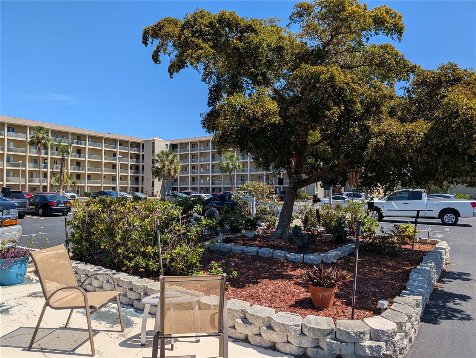 Charming Turnkey 1BR/1BA in Active 55+ Community! Even better price now! Welcome to this well-furnished, move-in-ready cutie located on the middle floor of K-bldg - this delightful unit offers a serene screened lanai where you can relax and take in peaceful treetop views. Inside, enjoy the bright and inviting space with tasteful furnishings, and a new AC system (2023) & three ceiling fans for year-round comfort. The spacious bedroom features two beds, one a newer king-size TempurPedic bed, ensuring restful nights. Conveniently located, with elevators and stairs at either and easy access to multiple coin laundry facilities on both 2nd and 4th floors. The community is packed with amenities! Take a dip in the beautiful lakeside heated pool, join in clubhouse activities, play a game of shuffleboard, or grill out at the gas BBQ area. Love the outdoors? The fishing pier and lakeside gliders provide a perfect spot to unwind and soak in the beauty of the water. All of this at a GREAT price! Close to shopping, dining, entertainment, and within 10 miles of spectacular Gulf beaches on Anna Maria Island. This turnkey condo is ready for you to enjoy. Just bring your toothbrush and start living the Florida lifestyle!