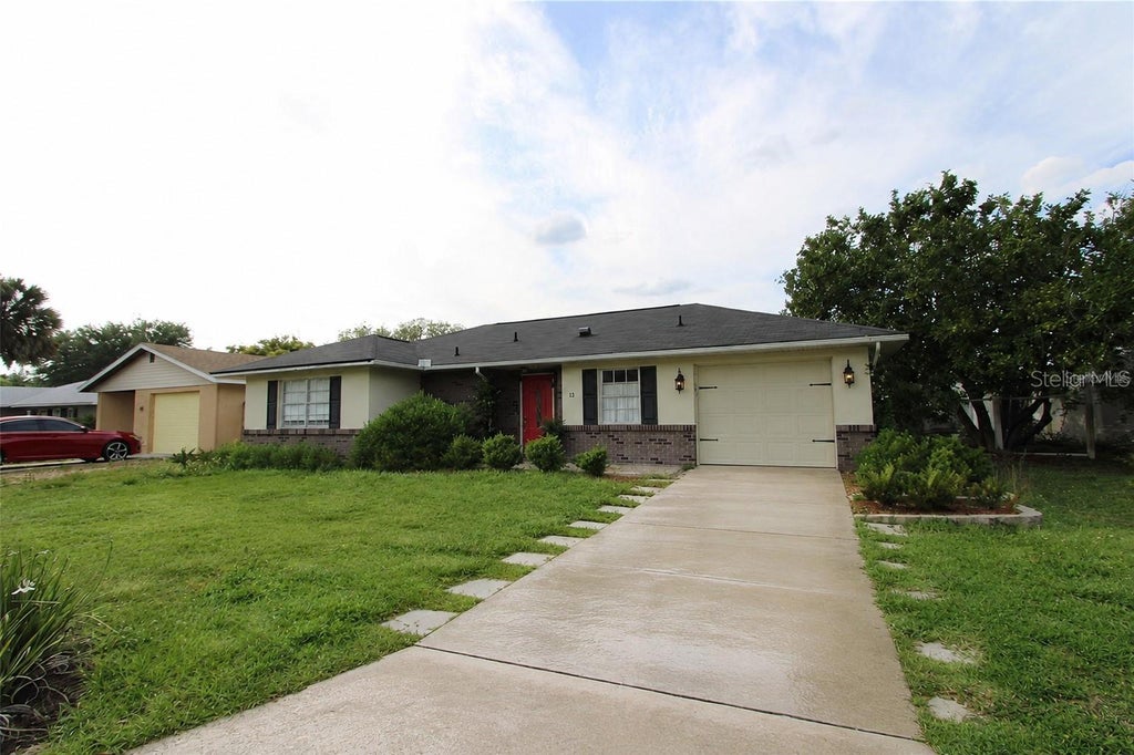Photo of 21 Sandalwood Drive, Davenport, FL 33837 (MLS # O6438500)