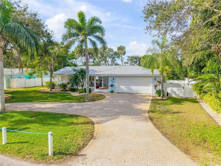 One compound. TWO homes (ADU) Be prepared to be WOWed. Discover one of the most rare and sought after compounds in New Smyrna Beach, located in the idyllic hamlet of Central Beachside. An exceptional property spread across an impossible to find 100’ x 150’ lot featuring TWO SEPARATE HOMES, (partially furnished and a lithium battery golf cart) salt water pool and hot tub, putt putt golf, she shed or artist workshop, a one of a kind summer kitchen, lush tropical landscaping, and space for everyone and everything, including boats, RVs, golf carts, and guests!  CHECK OUT THE LIST OF ITEMS INCLUDED IN YOUR NEW HOME AT THE BOTTOM SEE BELOW.

Welcome to the best kept secret in New Smyrna Beach. A quiet, no through traffic street in the heart of Central Beach where privacy and coastal charm blend perfectly. Craftsman home built in 1953 and lovingly cared for ever since, this home has been thoughtfully updated with the quality and attention to detail of a new build, all while maintaining its timeless character and charm.

Inside, the beauty is in the details: recently refinished Florida Heart Pine and Tiger Eye Maple floors. The chef’s kitchen features custom wood cabinetry, granite countertops and hand-blown glass pendants by artist Amber Marshall of Pennland, NC, paired with a brand new 36” Sub-Zero refrigerator and Wolf 6 burner gas range (installed Sept 2025). Additional features include new light fixtures, Kohler faucets and toilets, doors, hinges, knobs, hardware, fans throughout, and high end interior and exterior paint that showcases craftsmanship at every turn. 

The upgrades continue with new Kohler plumbing and toilets, new vanities, shiplap accent walls, and modern Dacor electrical plugs, switches, and plates(Oct 2025). The metal roof, Hardie board siding, and epoxy coated garage floor with high quality storage systems and hanging racks ensure durability and function. A new garage door opener (Sept 2025), Eufy security system, and electronic exterior door locks offer peace of mind. Even the primary bedroom A/C was replaced in Oct 2025 for maximum comfort.

The separate guest house offers a full kitchen, living room, walk-in closet, laundry, and a covered porch overlooking the saltwater pool and gas heated spa. Outdoors, enjoy a vintage inspired summer kitchen with a 1930s Roper gas range, custom putt putt course, and lush, freshly landscaped grounds with a blooming Royal Poinciana tree, and space for your orchid or vegetable garden.

Perched high atop a natural dune system with no history of flooding, even during major storms, this home offers a sense of security and seclusion, just blocks from the ocean, Intracoastal, Flagler Avenue, and the local Publix shopping center.

Surrounded by vinyl privacy fencing, the property feels like your own private resort. With ample parking, RV/boat storage, and a 10x16 air-conditioned shed (freshly painted in and out and new flooring). This home offers both charm and practicality, a one of a kind compound, never cookie cutter, and designed to bring people together.

This is not just a home, it’s a private coastal sanctuary, ready to welcome family, friends, and fun under the New Smyrna Beach sun.

INCLUDED IN THE SALE OF PROPERTY: LITHIUM GOLF CART, LIVING ROOM: FOUR SEASONS SECTIONAL WITH BRAND NEW COMPLETE SET OF SLIPCOVERS, RUG, MIRROR, CONSOLE 85" TV MASTER BEDROOM..ASK FOR A FULL LIST OF INVENTORY TO CONVEY