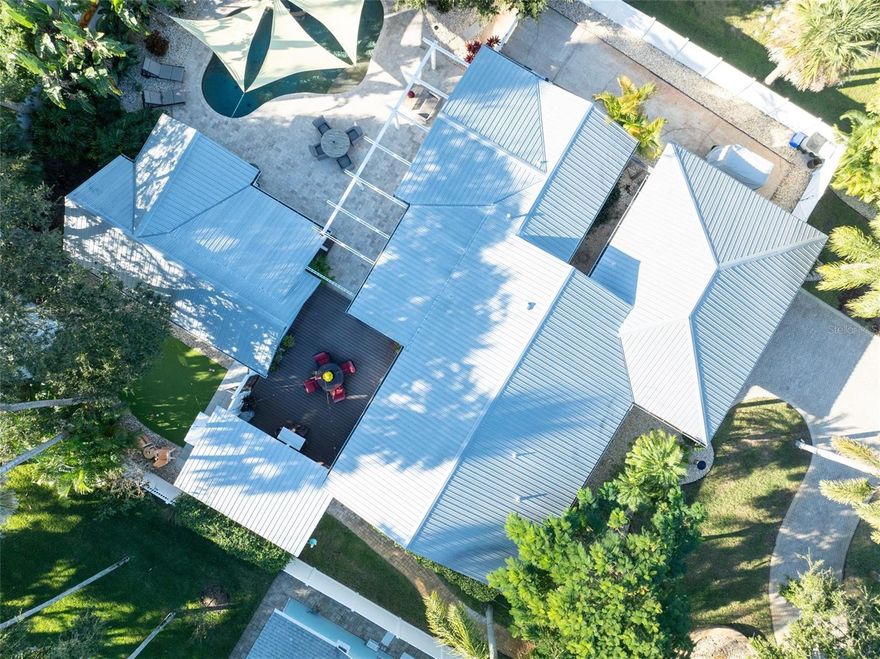 Discover one of the most rare and sought-after compounds in New Smyrna Beach, located in the idyllic hamlet of Central Beachside. An exceptional property spread across an impossible to find 100’ x 150’ lot featuring TWO SEPARATE HOMES, salt water pool and hot tub, putt putt golf, she shed or artist workshop, a one of a kind summer kitchen, lush tropical landscaping, and space for everyone and everything,  including boats, RVs, golf carts, and guests!

Welcome to the best kept secret in New Smyrna Beach. A quiet, no through traffic street in the heart of Central Beach where privacy and coastal charm blend perfectly. Craftsman home built in 1953 and lovingly cared for ever since, this home has been thoughtfully updated with the quality and attention to detail of a new build, all while maintaining its timeless character and charm.

Inside, the beauty is in the details: recently refinished Florida Heart Pine and Tiger Eye Maple floors,  new light fixtures, Kohler faucets and toilets, doors, hinges, knobs, hardware, fans throughout, and high end interior and exterior paint that showcases craftsmanship at every turn. The chef’s kitchen features custom wood cabinetry, granite countertops and hand-blown glass pendants by artist Amber Marshall of Pennland, NC, paired with a brand new 36” Sub-Zero refrigerator and Wolf 6 burner gas range (installed Sept 2025).

The upgrades continue with new Kohler plumbing and toilets, new vanities, shiplap accent walls, and modern Dacor electrical plugs, switches, and plates(Oct 2025). The metal roof, Hardie board siding, and epoxy coated garage floor with high quality storage systems and hanging racks ensure durability and function. A new garage door opener (Sept 2025), Eufy security system, and electronic exterior door locks offer peace of mind. Even the primary bedroom A/C was replaced in Oct 2025 for maximum comfort.




The separate guest house offers a full kitchen, living room, walk-in closet, laundry, and a covered porch overlooking the saltwater pool and gas heated spa. Outdoors, enjoy a vintage inspired summer kitchen with a 1930s Roper gas range, custom putt putt course, and lush, freshly landscaped grounds with a blooming Royal Poinciana tree, and space for your orchid or vegetable garden.

Perched high atop a natural dune system with no history of flooding, even during major storms, this home offers a sense of security and seclusion, just blocks from the ocean, Intracoastal, Flagler Avenue, and the local Publix shopping center.

Surrounded by vinyl privacy fencing, the property feels like your own private resort. With ample parking, RV/boat storage, and a 10x16 air-conditioned shed (freshly painted in and out and new flooring). This home offers both charm and practicality, a one-of-a-kind compound, never cookie cutter, and designed to bring people together.

This is not just a home, it’s a private coastal sanctuary, ready to welcome family, friends, and fun under the New Smyrna Beach sun.

Owners are Florida Licensed Real Estate Brokers.