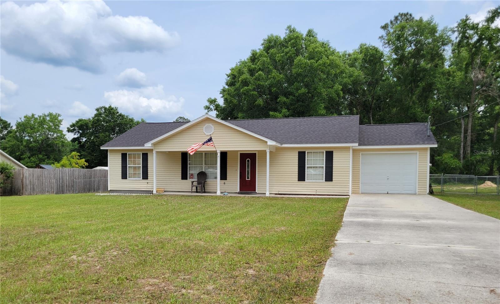 Charming 3bd 2bath home on a .5 acre lot boasts a fenced yard, detached shed, garage, front & back covered patio. Come sit and enjoy the Florida Lifestyle. Inside boasts luxury vinyl plank flooring, semi open floor plan, crown molding & wide baseboards through out the entire home. Double French doors lead out to your covered patio for those summertime cookouts. Galley style kitchen has stainless steel appliances, deep double sinks with garbage disposal, adjacent laundry room & a window to view the backyard. Expansive main bedroom has attached bathroom with tub shower combo, a linen closet & tile floors. Guest bedrooms are located on the opposite side with amble closet space. Guest bathroom features a shower tub combo with tile floors. New roof 2022.