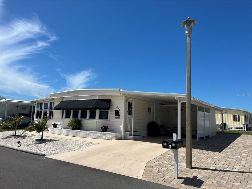 This one really has everything done, Florida room on main AC gives and additional 170 SQ ft added living space, vinyl siding, newer tinted windows, new carport, added pavers for side by side parking, AC 2021, New aluminum roof in 2025, newer kitchen cabinets all with pull out drawers, Tiled Livingroom, kitchen & dining room, laminate with plywood underlay in bedrooms, all new 6 panel doors, repiped supply plumbing, New baths in master and guest, Drywall in both bedrooms, Newer interior electric panel, immaculate furnishing too.
Venice Isle is the premier resident owned over 55 Mobile home Park in Venice.  There are close to 1000 homes with the most active residents. There is always something going on for you to do. We have many Park gatherings and first rate shows on site. The Park has every amenity you can imagine. Come take a walk through both of our 2 clubhouses and make yourself at home. The Park has 2 tennis courts, a fitness center, 2 heated pools, 2 hot tubs, saunas, putting greens, shuffleboard, Bocce ball, miniature golf, art rooms, pool room, TV lounges, card rooms, library, horseshoes, ceramic kilns, 2 huge ballrooms, Sunday services and much more!