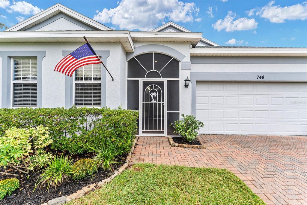 Photo of 748 Summit Greens Boulevard, Clermont, FL 34711 (MLS # O6347850)