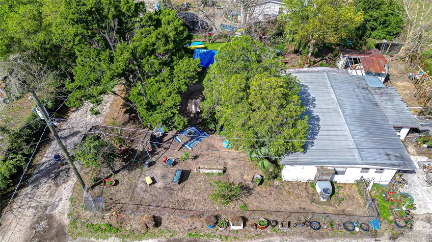 Great opportunity to build your dream home or place a manufactured/mobile home on this spacious 91 x 115 lot. Value is in the land. Property is zoned for one single-family home or mobile home and offers plenty of potential. No HOA or CDD! The lot will require well and septic. Currently a concrete block single-family home sits on the property that will require a complete renovation or could be removed for new construction. Located in Flood Zone X for added peace of mind. Conveniently situated near I-75 and I-4, the University of South Florida, hospitals, shopping, and dining.