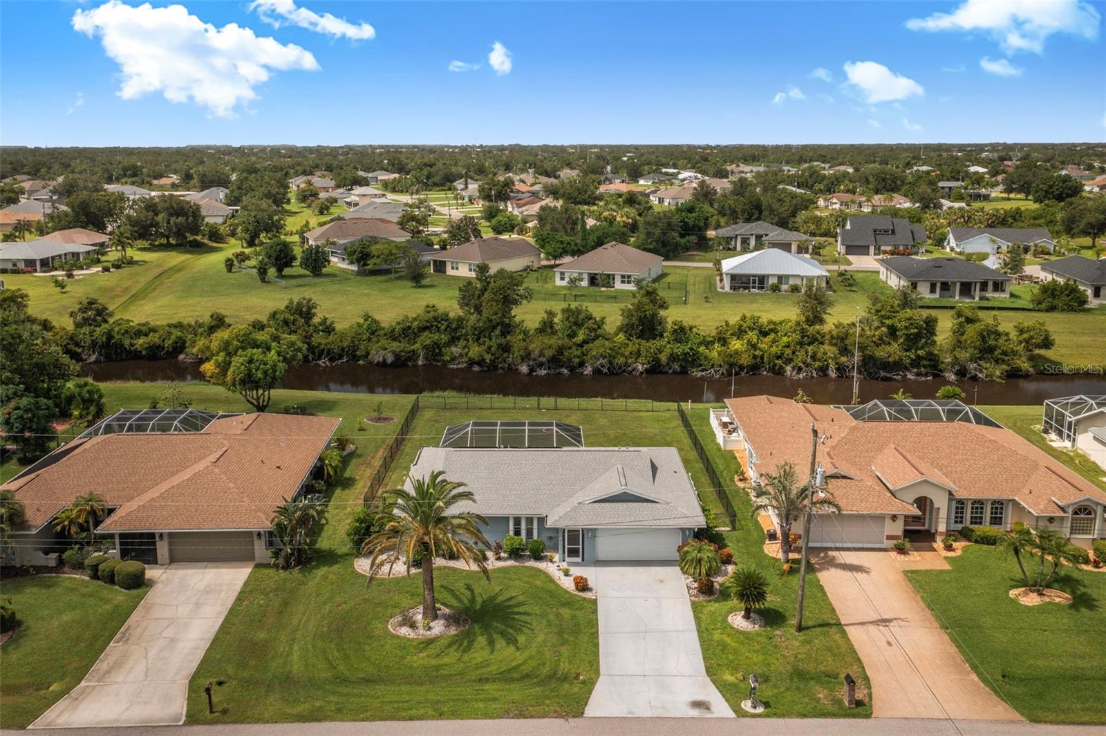 Discover the perfect blend of comfort and outdoor living in this 3-bedroom, 2-bath pool home, nestled on a freshwater canal in the sought-after Deep Creek community in Punta Gorda.
Enjoy a spacious split-bedroom layout that offers privacy and functionality, with plenty of natural light throughout. Step outside to a screened lanai with both covered and open areas, giving you the choice of sun or shade while overlooking the refreshing pool, an ideal setup for relaxing or entertaining guests.
The large, fenced backyard provides room to play and pets to roam, while the greenbelt and canal views create a tranquil backdrop for your outdoor lifestyle. Spend your evenings fishing from your own yard or simply soaking in the peaceful surroundings.
This home is the perfect opportunity to embrace the Florida lifestyle in a beautiful neighborhood close to everything Punta Gorda has to offer.