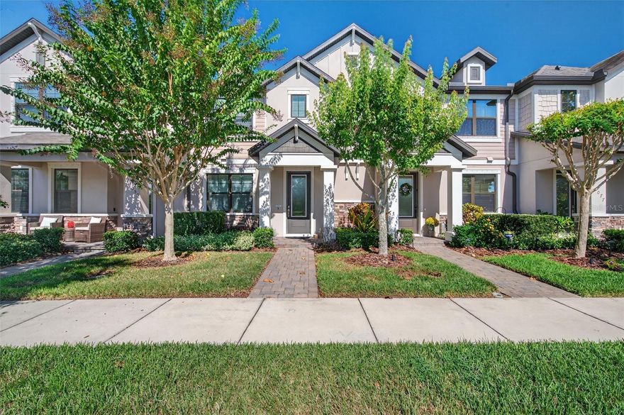 Beautifully designed Townhome exudes modern elegance and comfort, featuring stylish no-carpet living spaces and exceptional attention to detail including custom Plantation Shutters throughout. The chef-inspired Kitchen is a true showpiece with Stainless Steel Appliances, a Gas Range, Quartz Countertops, an oversized Island, Wood Cabinetry, a breakfast bar, and an expansive walk-in pantry. Additional highlights consisting of custom walk-in Pantry, custom Electric Fireplace with Shiplap & fully equipped laundry room all combining functionality with luxury.  Wood floor Staircase leads you up to the spacious Master Suite and 2 additional Bedrooms. Wake up each morning to serene pond views from your primary suite and enjoy quiet moments on the screened and paved lanai, ideal for relaxing or entertaining. A covered walkway connects to the attached 2 Car Garage, complementing the home’s thoughtful layout and design.  Located within the highly sought-after Starkey Ranch community, this property offers a lifestyle unlike any other. Residents enjoy access to beautifully maintained grounds, resort-style amenities, and endless recreation surrounded by lakes, green spaces, and nature preserves.  Enjoy the ease of a maintenance-free lifestyle where the low monthly HOA covers exterior upkeep, Landscaping, Reclaimed Water for Irrigation, Pest Control, Trash, Recycling, and access to an array of premier amenities. Every corner of the neighborhood has been designed for beauty, connection, and convenience, with Starkey Market, Starkey Ranch K–8 Magnet Schools, shopping, dining, medical facilities, and more just a short walk away. All of this, only 30 minutes from downtown Tampa and the beaches, makes this home the perfect blend of sophistication, comfort, and location. LET'S GET IT SOLD!!!