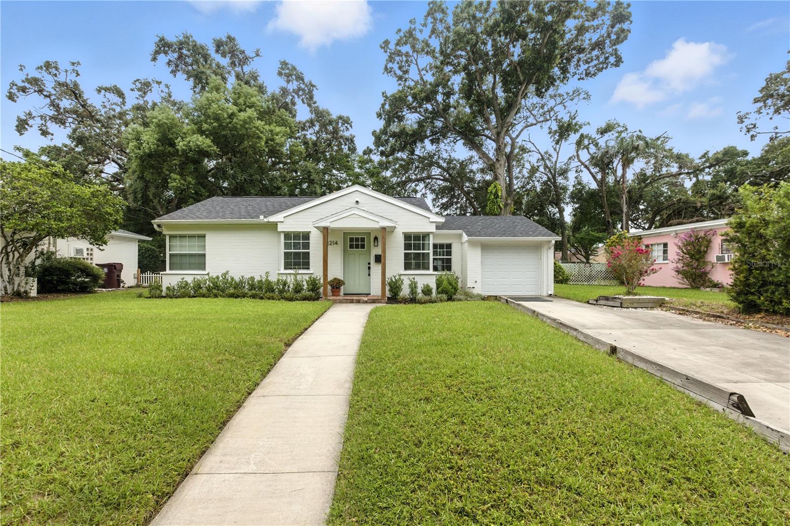 Welcome to 2214 Valencia Road, a beautifully cared-for mid-century bungalow located in one of Orlando’s most desirable neighborhoods, the Milk District. Meticulously maintained and thoughtfully updated over the years, it’s the kind of home that instantly shows it has been truly cared for. The curb appeal is immediately inviting, enhanced by fresh landscaping, a newly painted exterior, updated gutters, and a new modern irrigation system at the front of the property. Step inside through the new front door and into an open and light-filled living space with vintage character. The dining room features a stunning wood-paneled ceiling, and large windows invite in natural light and views of the spacious, private, fenced-in backyard. The renovated kitchen features stylish finishes and smart storage solutions, and comes fully equipped with all included appliances. This two-bedroom, one-bathroom single-family home has been carefully lived in, and every improvement shows a true pride of ownership. Major system updates include a new roof and HVAC system (both 2021), as well as updated plumbing, a newer water heater, fresh interior paint, and a newer garage door. The garage has been intentionally reimagined as a dedicated space, perfect for fitness, hobbies, or any home gym–related uses. Everything about this home has been dialed in, nothing feels neglected or forgotten. Step outside to a newly fenced backyard with vinyl fencing, a freshly mowed lawn, and a large storage shed that adds valuable space for tools or equipment. Beyond the home itself, the location is what stands out the most. Positioned in the heart of the Milk District, this home offers close proximity to Thornton Park, Lake Eola, Downtown Orlando, and major highways. It’s also just steps from some of Orlando’s favorite local spots, including restaurants, shopping, community events, and Colonial Plaza. 2214 Valencia Road offers a rare opportunity to own a home that’s been deeply loved. This is more than just a house, it is a home ready to welcome its next chapter. Schedule your private showing today!