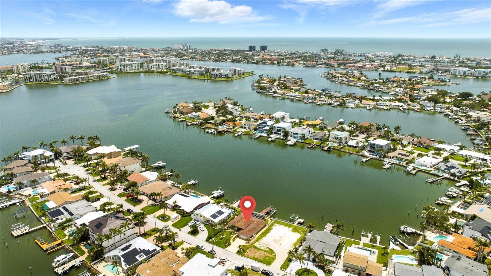 One or more photo(s) has been virtually staged. Where Every Day Feels Like Vacation! Discover your dream waterfront lifestyle in this fully remodeled coastal retreat located in the coveted Yacht Club Estates of St. Petersburg, FL. With direct access to the Gulf of Mexico and no fixed bridges, this is a boater’s paradise—complete with a 13,000 lb boat lift, private dock, and deep-water canal just steps from your back door. Cruise to Shell Key, Egmont Key, or enjoy waterfront dining at nearby favorites—all from your own backyard. After a day on the water, unwind in your private pool and spa, all within a spacious screened-in lanai perfect for relaxing or entertaining. Inside, enjoy high-end finishes, open-concept living, and coastal elegance throughout. Located just minutes from the white sands of Treasure Island and the vibrant arts, dining, and nightlife of downtown St. Pete. Surrounding the sparkling pool is a travertine patio that exudes timeless style, complemented by a spacious covered outdoor living area. A paver driveway, front walkway, and entry create a grand and welcoming first impression.Whether you're a boater, beach lover, or foodie—this home offers the ultimate Florida lifestyle!