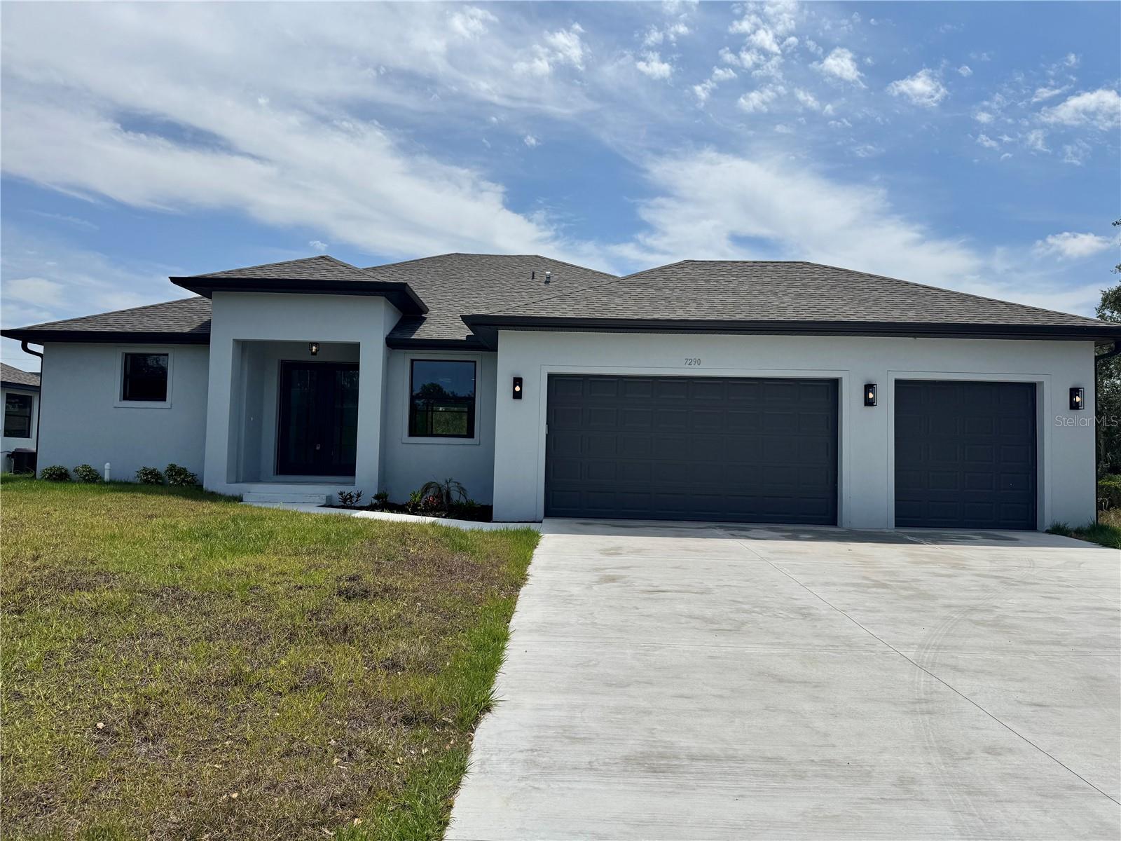 MOVE IN READY! Beautiful 3 bedroom, 2 bath, pool home with a hot tub, flex room and a 3 car garage. This new construction home features porcelain tile throughout, 9'4 ceilings with ceiling trays in living area and owners bedroom. The kitchen has all wood 42 inch cabinets with crown molding and quartz counters, just off the kitchen the laundry room has additional cabinets for extra storage. Bathrooms also have all wood cabinets and quartz countertops with porcelin tile to the ceiling in both shower and bath area. Sliding doors from living area, kitchen and owners bedroom leads to the large lanai and pool area. The garage holds 3 full size vehicles. Photos of previous built home.