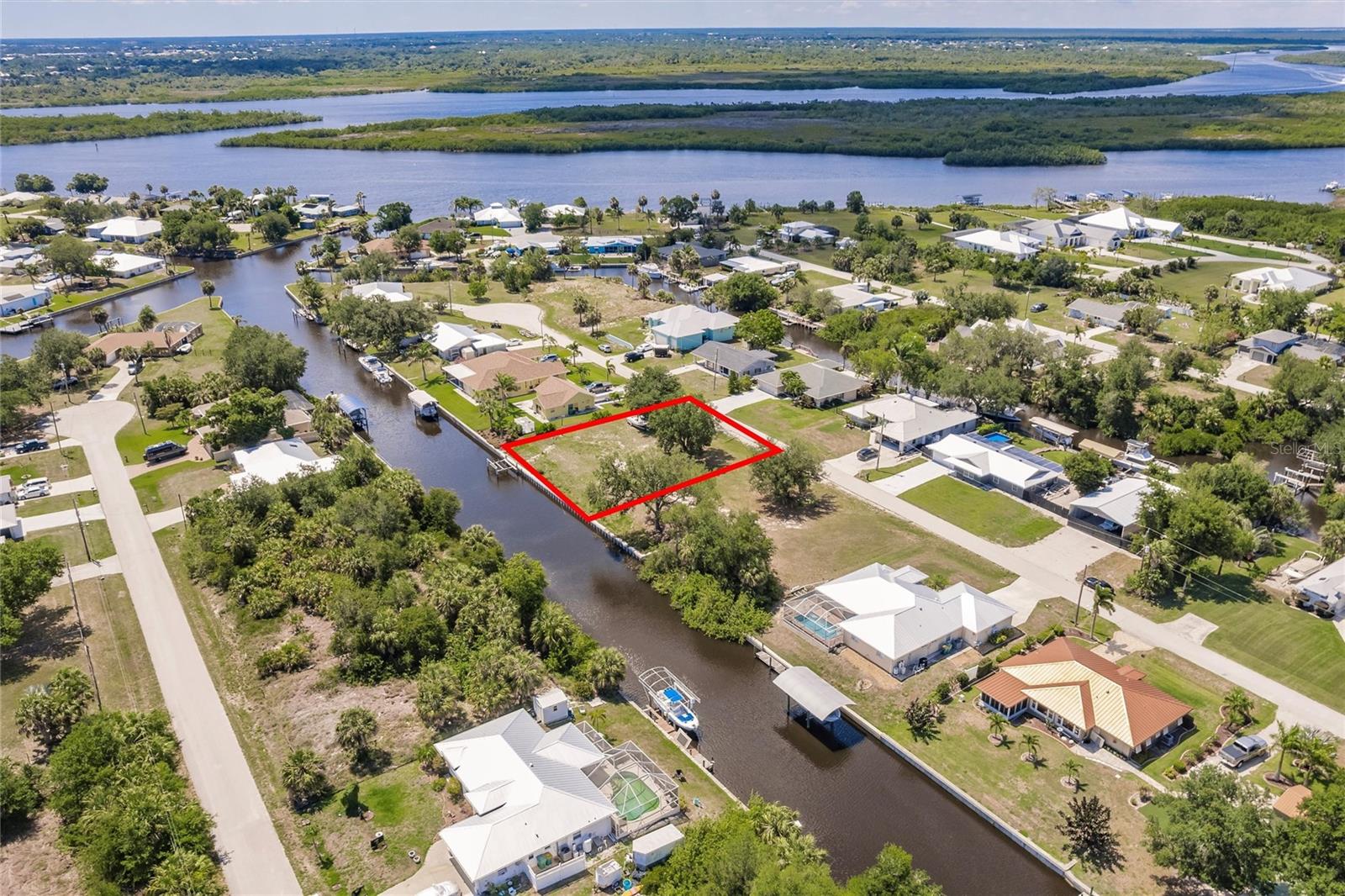 Discover the perfect blend of peace and potential with this 80-foot canal-front lot in Palm Shores (NO HOA), ideally situated on a quiet cul-de-sac road. With a concrete seawall, electric and lift already in place, this prime cleared parcel is ready for your dream home. Located in a serene waterfront community known for its outstanding fishing and abundant wildlife, you'll enjoy direct access to the Peace River and Charlotte Harbor. Only two high-clearance bridges—each over 40 feet—stand between you and the open waters of the Gulf of Mexico, making this a boater’s paradise. Embrace the natural beauty that surrounds you as you explore the scenic waterways. This is .22-acre lot and is not in a Scrub Jay Zone (check again during due diligence to ensure nothing has changed). All this tranquility comes with the convenience of being just minutes from Punta Gorda’s charming historic district, local shops, and quick access to I-75. SELLING LOTS 135 AND 134 SEPARATE. WILL BE SPLIT AT CLOSING. SEE MLS# C7509897 for Lot 134.