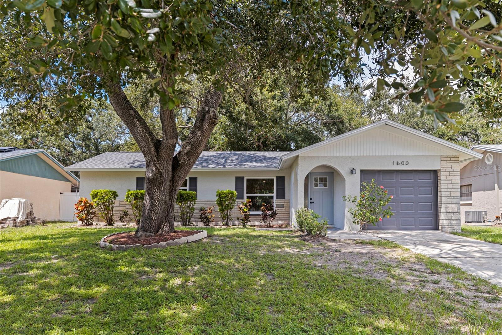 Welcome home to the peaceful retreat you’ve been dreaming of in the heart of Dunedin. 1600 Amberlea isn’t just a house—it’s a place where comfort and warmth meet thoughtful design. This beautifully updated two-bedroom, two-bathroom home with a one-car garage sits on an oversized 8,000+ sq ft lot, giving you the perfect canvas for your lifestyle—whether that’s a sparkling pool, cozy firepit evenings, or simply enjoying a quiet morning coffee in your spacious backyard sanctuary. Step inside and you’ll feel the care that’s gone into every detail. The home has been lovingly refreshed to create a calm, welcoming space where you can truly unwind at the end of the day. From the brand-new kitchen with quartz countertops and stainless steel appliances to the elegant new bathrooms, new flooring with lifetime warranty, and fresh paint throughout, everything has been designed to be move-in ready so you can start making memories right away. Major updates like a brand new roof, newer electric panel, newer windows, and epoxy-coated garage floor add peace of mind for years to come. This isn’t just a property—it’s your opportunity to create the life you’ve been waiting for in one of Dunedin’s most charming neighborhoods. Don’t miss the chance to make it yours before it’s gone!