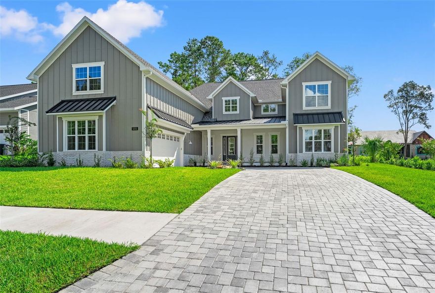 Experience unparalleled elegance in this custom-built, one-of-a-kind 5-bedroom, 3-bathroom luxury home nestled within the prestigious Southern Hills Plantation Club, set along the iconic Pete Dye-designed 18-hole golf course. This stunning 2-story residence welcomes you with soaring 22' ceilings, custom beams, and expansive second-story windows that flood the space with natural light, highlighting an exquisite living room adorned with a striking porcelain and oak paneling feature wall. The gourmet kitchen is a chef's dream, featuring a sleek porcelain island, sophisticated under- and above-cabinet lighting, a top-of-the-line Z-Line appliance package, a gas cooktop and oven, and an additional wall oven. Above the spacious 2-car garage, a versatile converted loft space offers endless possibilities—perfect as a theater room, game room, wellness retreat, or anything you can imagine! Outside, beautifully paved front and back patios provide serene spots to relax, with views of a neighbor-owned lot, which has been created into a botanical garden next door and an undeveloped lot across the street, ensuring exceptional privacy and tranquility. Residents enjoy exclusive access to Southern Hills' resort-style amenities, including a par-3 walking course, putting greens, pro shop, clubhouse, pool, spa, poolside dining, gym, pickleball, and Har-Tru tennis courts—all just under an hour from Tampa. This architectural gem seamlessly blends modern sophistication with timeless luxury. Call today to schedule a private tour of this extraordinary home!