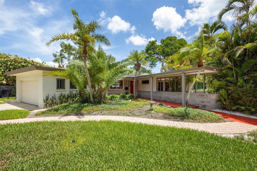 An Architecturally Significant Mid-Century Masterpiece in Bahama Shores
Designed by celebrated local architect William Harvard—whose legacy includes the former iconic Pier, the Williams Park Bandstand, and Pasadena Community Church—this exceptional Mid-Century Modern residence offers a rare opportunity to own a thoughtfully restored work of architectural history in one of St. Petersburg’s most desirable neighborhoods.
Set on an expansive, pie-shaped lot, this 2-bedroom, 2.5-bath home seamlessly blends timeless design with refined modern living. Original architectural elements have been meticulously preserved, including exposed wood-beam ceilings, dramatic Zappelli African hardwood full-wall pocketing sliders opening onto walled terrace and a striking wood-burning fireplace that ingeniously converts to an outdoor grill—a true hallmark of mid-century ingenuity.
The home has undergone a comprehensive renovation with a focus on both luxury and long-term performance. In 2018, the residence was completely re-wired and re-plumbed, and the insulation was replaced, significantly improving energy efficiency and comfort. The AC system was replaced in 2024, offering peace of mind for years to come.
At the heart of the home, the designer kitchen features quartz countertops, custom Wellborn cabinetry, and premium Fisher & Paykel appliances, including a dual fuel gas range, smart hood, wine refrigerator, and cabinet-integrated double dishwasher—perfectly suited for both elegant entertaining and everyday living.
Indoor and outdoor spaces connect effortlessly through French accordion doors, opening to a private lanai and saltwater pool, creating a resort-like setting ideal for relaxed gatherings or quiet evenings at home. The pool pump was replaced in 2025, and the property includes plumbing for a future outdoor shower and outdoor kitchen (both gas and water). A built-in brick grill further enhances the outdoor entertaining experience.
Both full bathrooms are configured as ensuite retreats, with the primary suite offering marble countertops and a walk-in shower. A discreet half bath provides convenient access from the pool, garden, and main living areas. Additional features include a two-car garage with laundry, impact-rated windows, and subtle peekaboo views of Tampa Bay.
The home is fully integrated with smart technology, including a Lutron lighting system for automated interior and exterior ambiance and a Rachio smart irrigation system designed to conserve water while maintaining lush landscaping.
Located in Bahama Shores, an exceptional waterfront neighborhood known for its walkability, canopy of mature trees, and strong sense of community, this home offers a rare blend of architectural pedigree, modern efficiency, and an enviable lifestyle. Located convenient to I-275, downtown St Petersburg, and the beaches, it is truly one of the best neighborhoods in St Petersburg. 
Don’t miss the opportunity to own this truly one-of-a-kind mid-century residence—restored, refined, and ready to be appreciated by the most discerning buyer. Schedule a home showing today!
