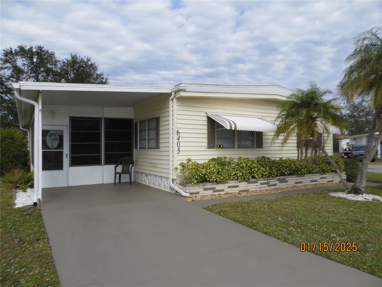Lovely furnished, turnkey, and tastefully decorated home on a corner lot in Phase II where pets are allowed. This home features an open floor plan and an inside washer/dryer. You are lucky enough to have a lanai AND a sunroom. There is laminate flooring in the kitchen/dinette and luxury vinyl plank in the living room. Updates include new A/C in Feb 2024 and new membrane roof in 2022. Holiday Park Park and Recreation District is a 55+ deed restricted, gated community. Unlike most mobile home communities in the area, it is a Special District, not an HOA. There are no monthly HOA fees, but there is a Non-Ad Valorem Assessment due annually on your tax bill.