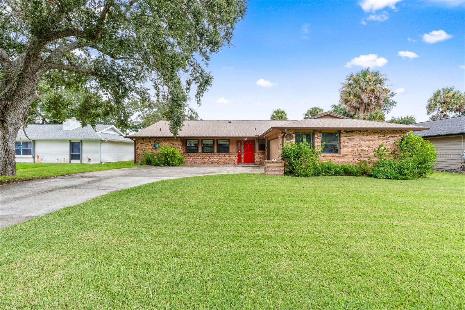 Welcome to 1219 Wayne Avenue in New Smyrna Beach! Seconds away from the local municipal golf course & just minutes to the beach. However with a view and water access like this you may just want to stay home a little more!! This remodeled 3 bedroom, 2 bath home features a split floorplan, vaulted ceilings, remodeled baths, spacious 2-car garage and a brand-new roof. Inside, you’ll find an open layout with plenty of natural light and recent renovations that make the home move-in ready. Plus, a formal living and dining making room for any occasion! New laminate floors, granite countertops, recess lighting, new cabinets.. & the list goes on! Plus an additional 36x13 converted florida room which truly elevates the space within.
Step outside to your private backyard retreat with a saltwater pool, large deck, and your own dock on the canal—perfect for fishing, kayaking, or simply relaxing by the water. The outdoor space is ideal for entertaining or enjoying quiet evenings at home.
The location is hard to beat—just minutes from The Garlic, drive on beach access, local shopping, golf courses, and major highways for easy commuting. This home combines modern updates, outdoor living, and a prime coastal lifestyle in one package! Schedule your tour today!