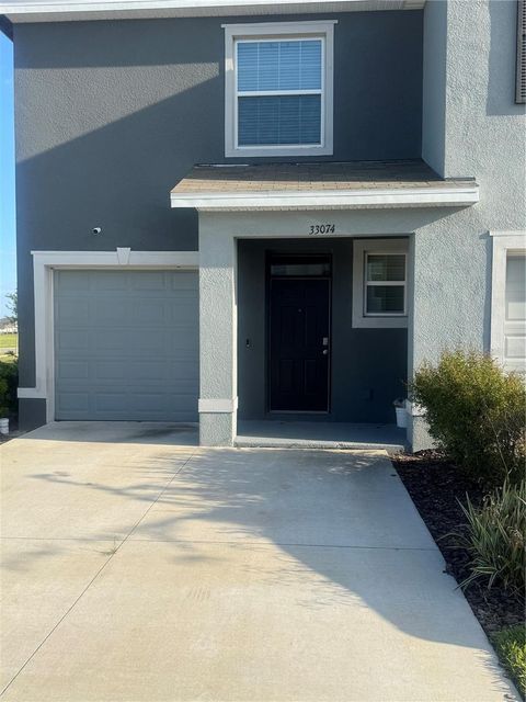 Photo of 33074 Tulip Petal Lane, Wesley Chapel, FL 33545 (MLS # TB8497648)