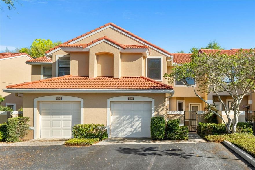 Tucked into one of Maitland's most coveted lakefront enclaves, this beautifully updated townhome sits within a quietly maintained, tree-lined setting with direct access to Lake Destiny, a private community boat ramp, resort-style pool, and tennis courts, all just minutes from I-4, the 414, RDV Sportsplex, and the dining and shopping corridors of Maitland Center. First impressions set a private and secluded tone with a wrought-iron gated courtyard leads to a covered entry porch before you reach the front door. Inside, soaring vaulted ceilings and a dramatic arched transom window above the sliding glass doors flood the main level with natural light, creating an airy, open feel that far exceeds the square footage on paper. Wide-plank tile flooring runs throughout the main living areas, connecting the open living and dining spaces to a thoughtfully updated kitchen featuring white shaker cabinetry with crown accents, solid stone countertops, stainless steel appliances including a French door refrigerator and built-in microwave, pendant lighting above the breakfast bar peninsula, and a subway tile backsplash. The sliding doors open directly to a private screened patio framed by mature landscaping, creating the kind of indoor-outdoor flow that defines Florida living at its best. Upstairs, three generously sized bedrooms each offer ceiling fans, ample closet space, and brand new carpet and paint. The primary suite stands out with a 26ft footprint, two closets including a walk-in, and an ensuite bath featuring dual vanities, a full-wall vanity mirror, and a walk-in shower. Two additional bedrooms and a full bath complete the upper level, with the layout providing genuine separation and privacy between spaces. Back on the main floor, a versatile 9x9 bonus room with indoor laundry handles the day-to-day,
and the full-size washer and dryer convey. The big-ticket items are handled: 30-year tile roof replaced in 2023, HVAC installed in 2020, and brushed nickel fixtures updated throughout. The one-car garage with additional driveway parking and the gated courtyard entry give this unit a sense of privacy and security rare in townhome living. Whether you are looking for a low-maintenance primary residence, a lock-and-leave second home, or a smart investment in a well-managed community with real amenities and a lakefront address, this one makes an easy case.